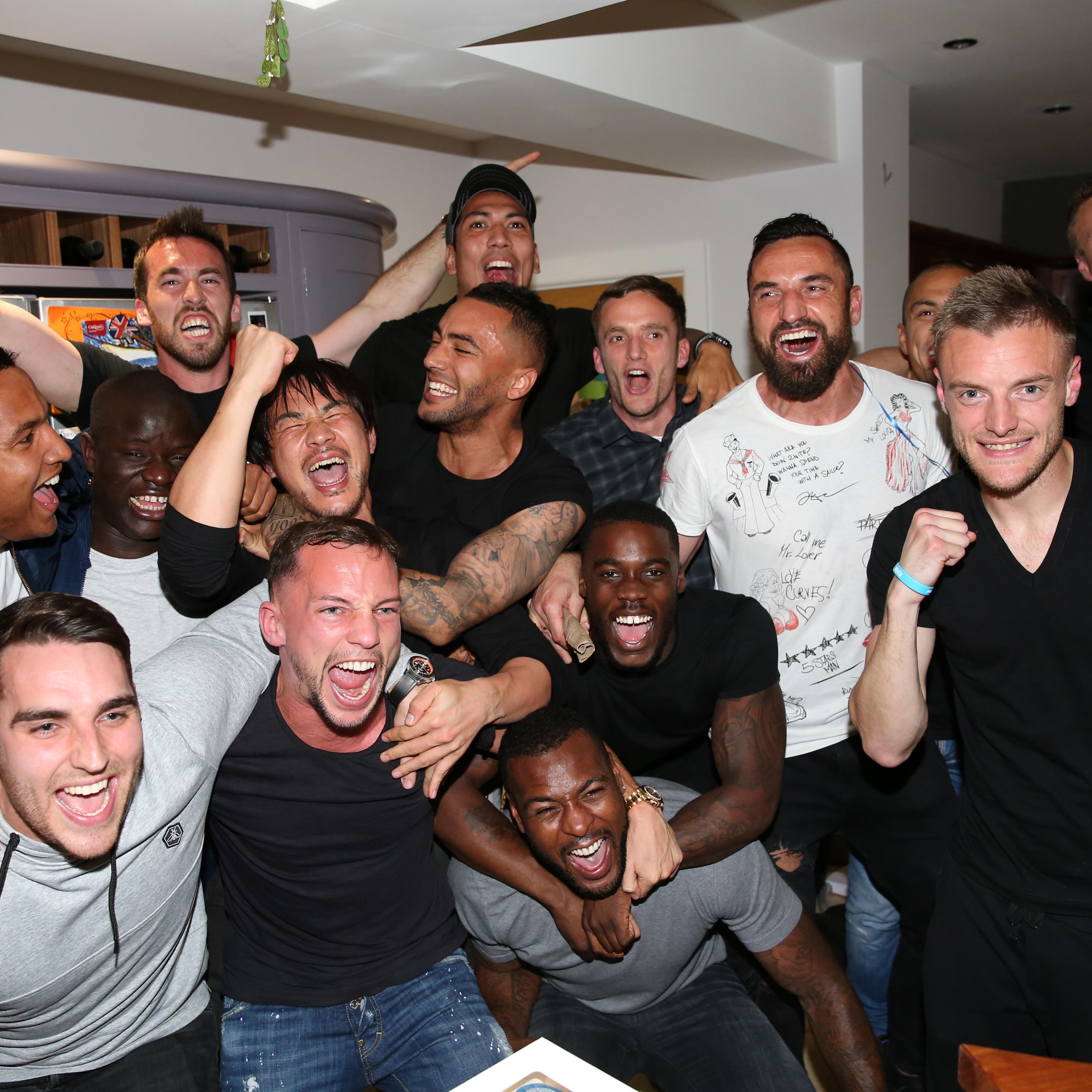Settle down boys: Players on the champion Leicester City Football Club watch rivals on TV during their championship run.