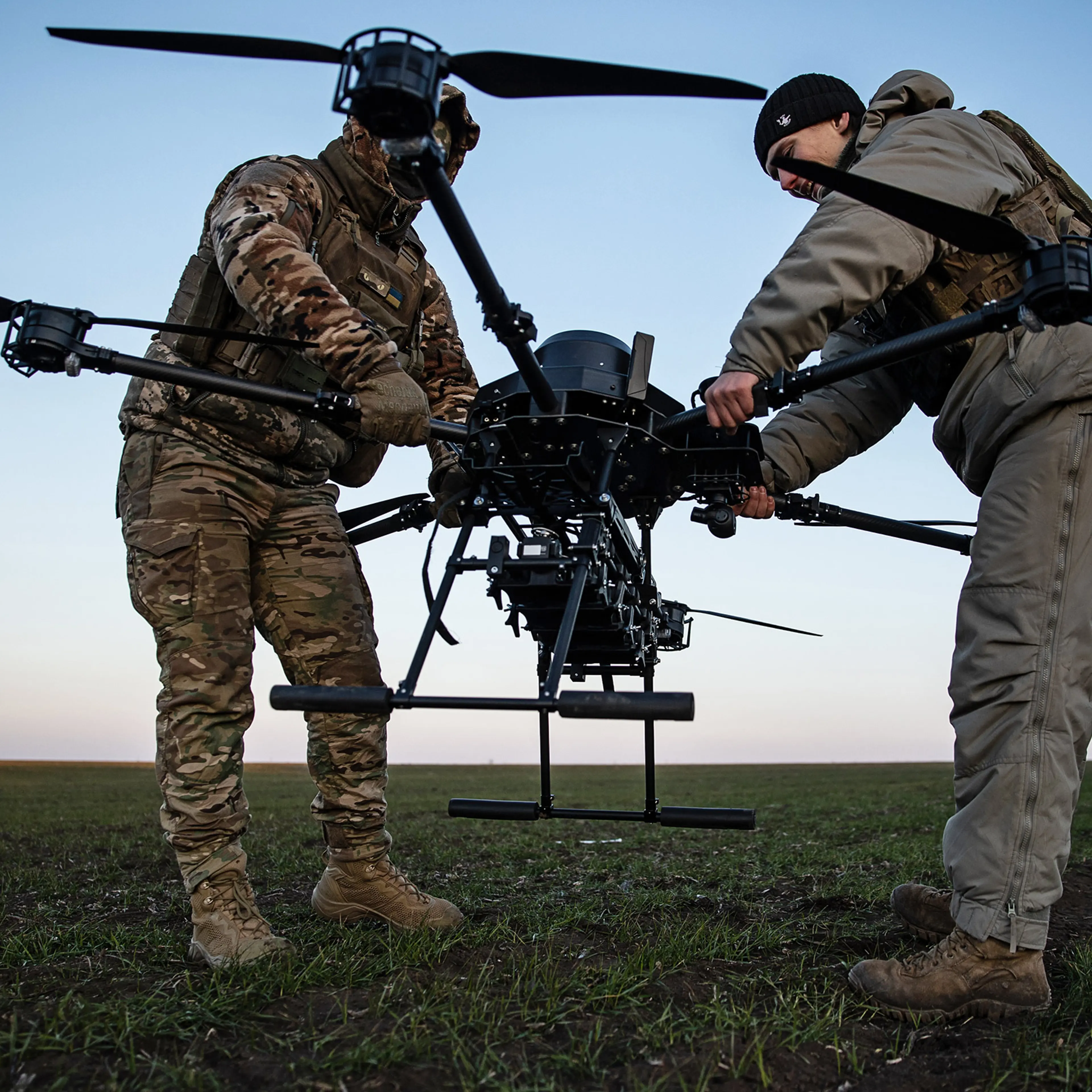 Ukrainian soldiers carry a Vampire drone after a training flight on Feb. 8, 2025.