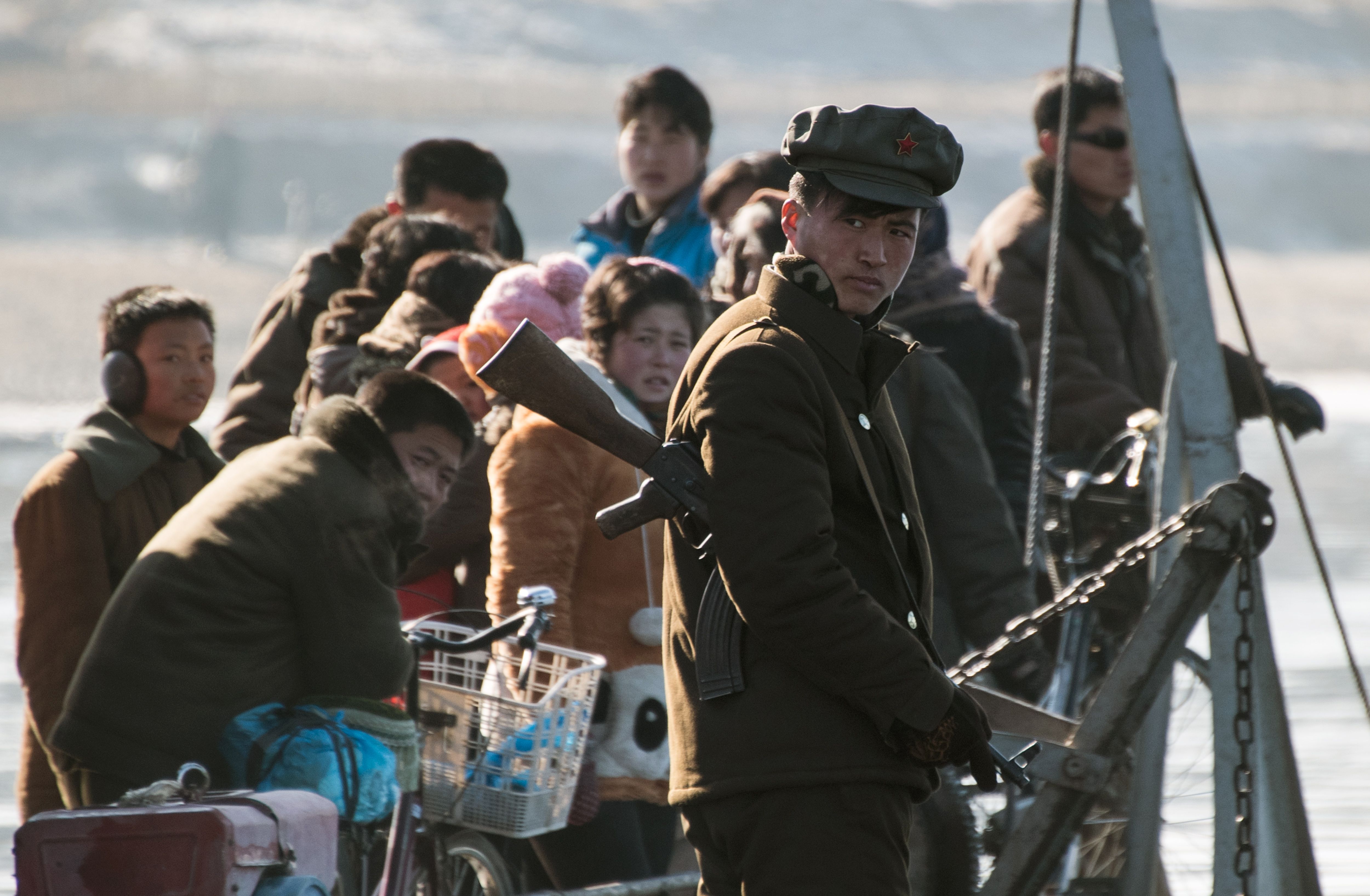 A North Korean soldier stands on a boat on the Yalu River near the town of Sinuiju across from the Chinese border town of Dandong on Feb. 9, 2016.