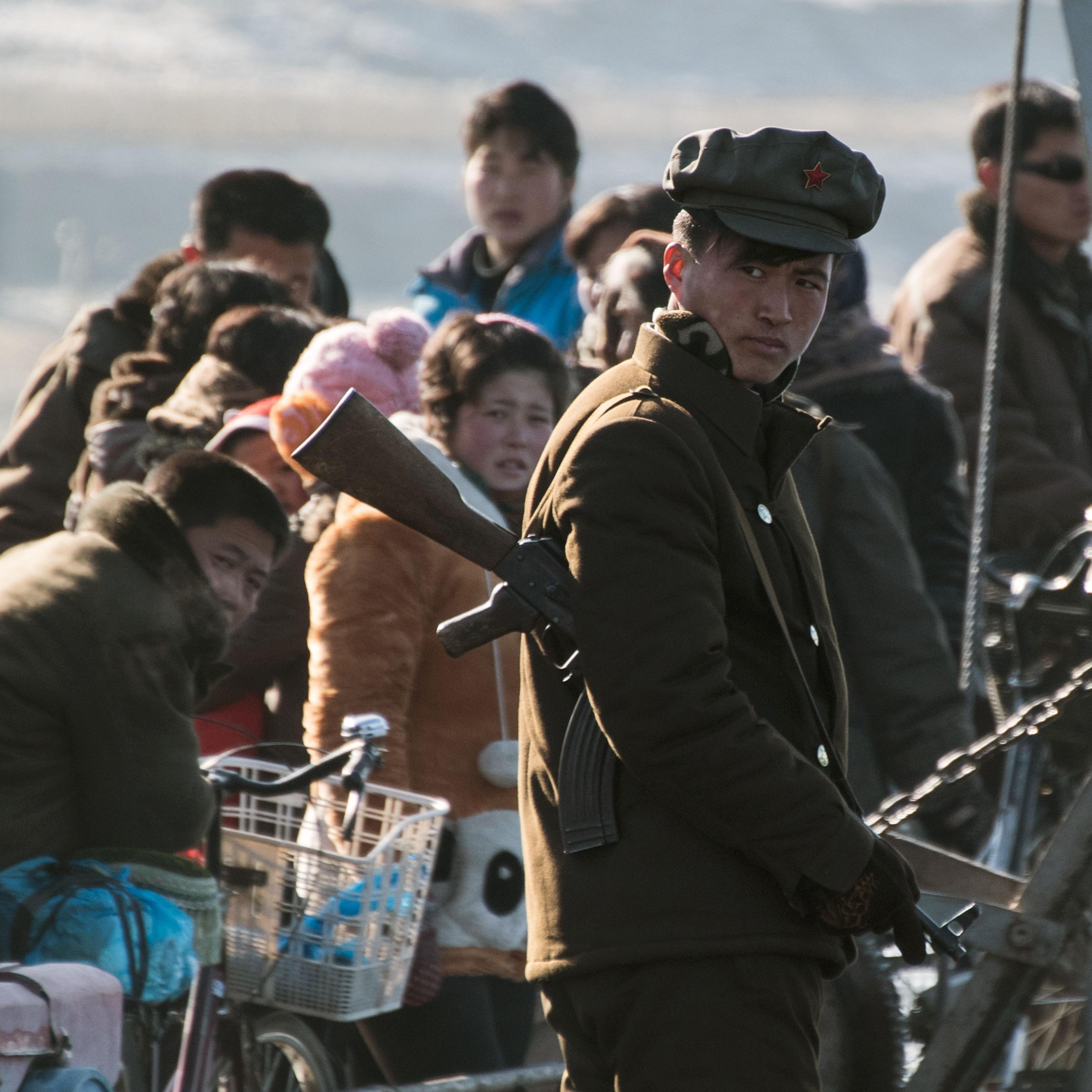 A North Korean soldier stands on a boat on the Yalu River near the town of Sinuiju across from the Chinese border town of Dandong on Feb. 9, 2016.