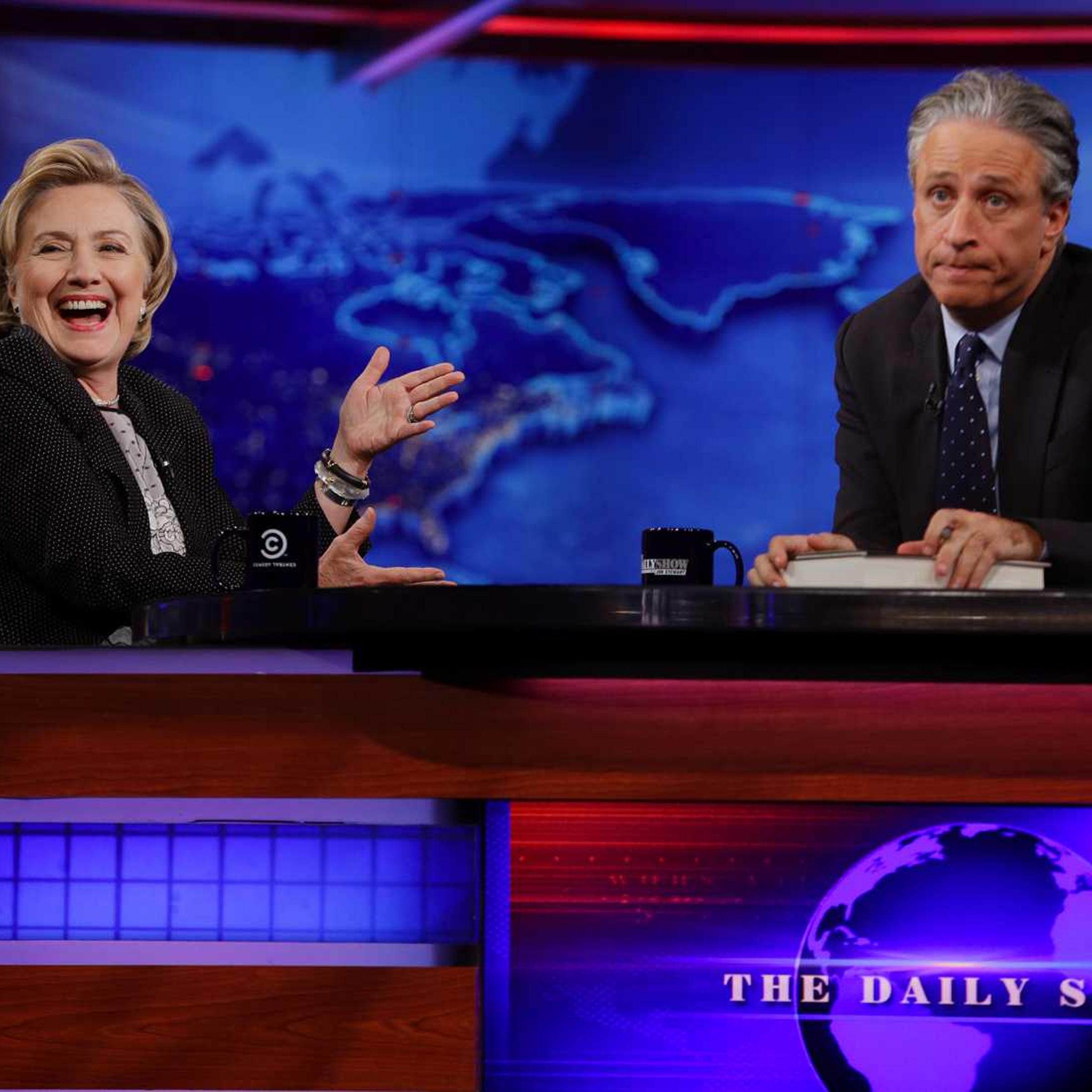 Former U.S. Secretary of State Hillary Clinton listens to host Jon Stewart during a taping of <i>The Daily Show</i>, Tuesday, July 15, 2014, in New York City.