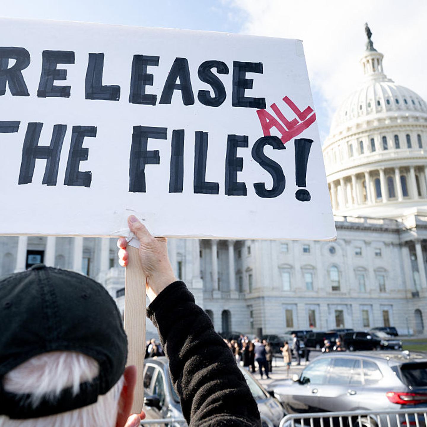 A protester holds a sign related to the release of the Jeffrey Epstein case files outside the U.S. Capitol in Washington, D.C., on Nov. 12, 2025.
