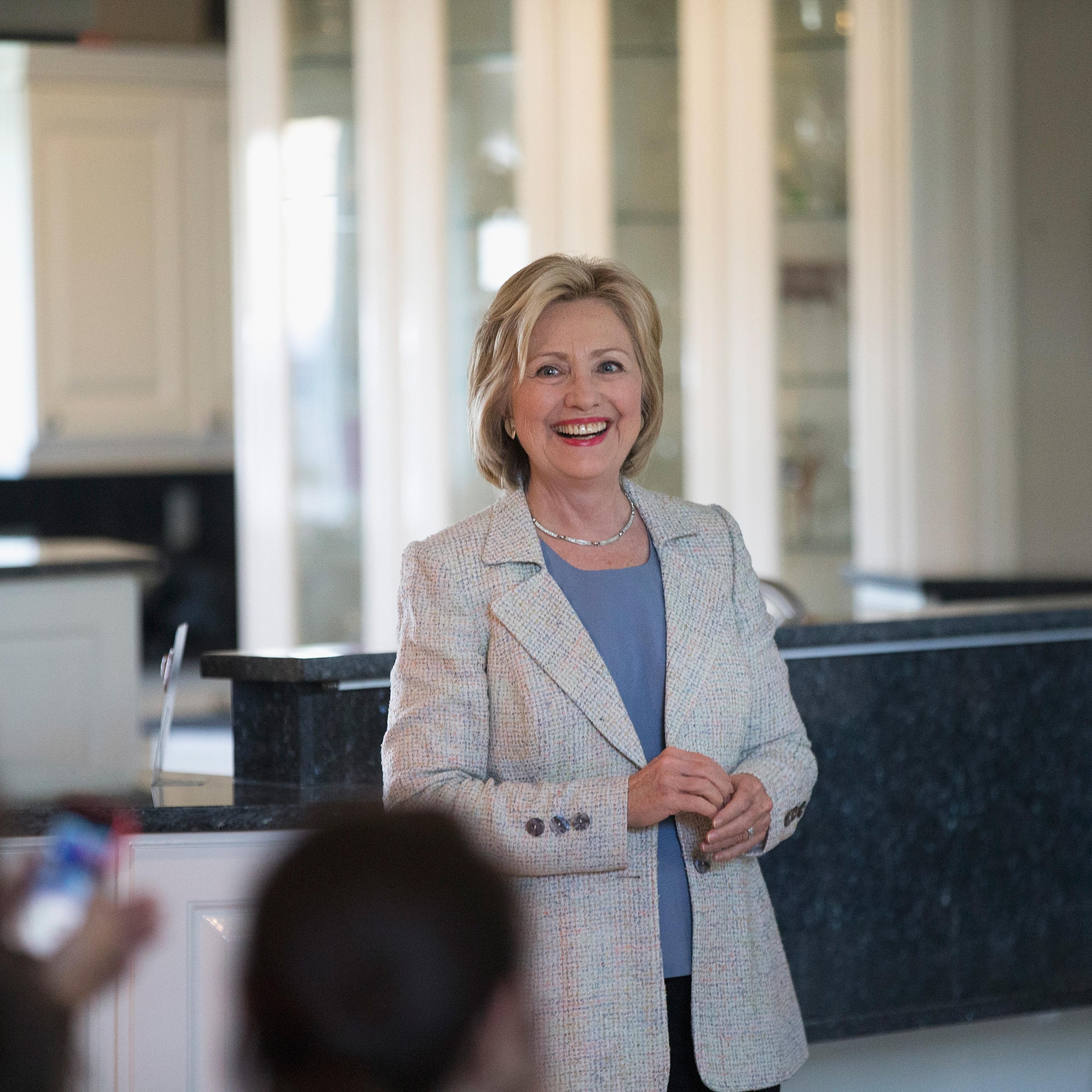 Democratic presidential hopeful and former Secretary of State Hillary Clinton waits to be introduced at a house party on July 26, 2015 in Carroll, Iowa.