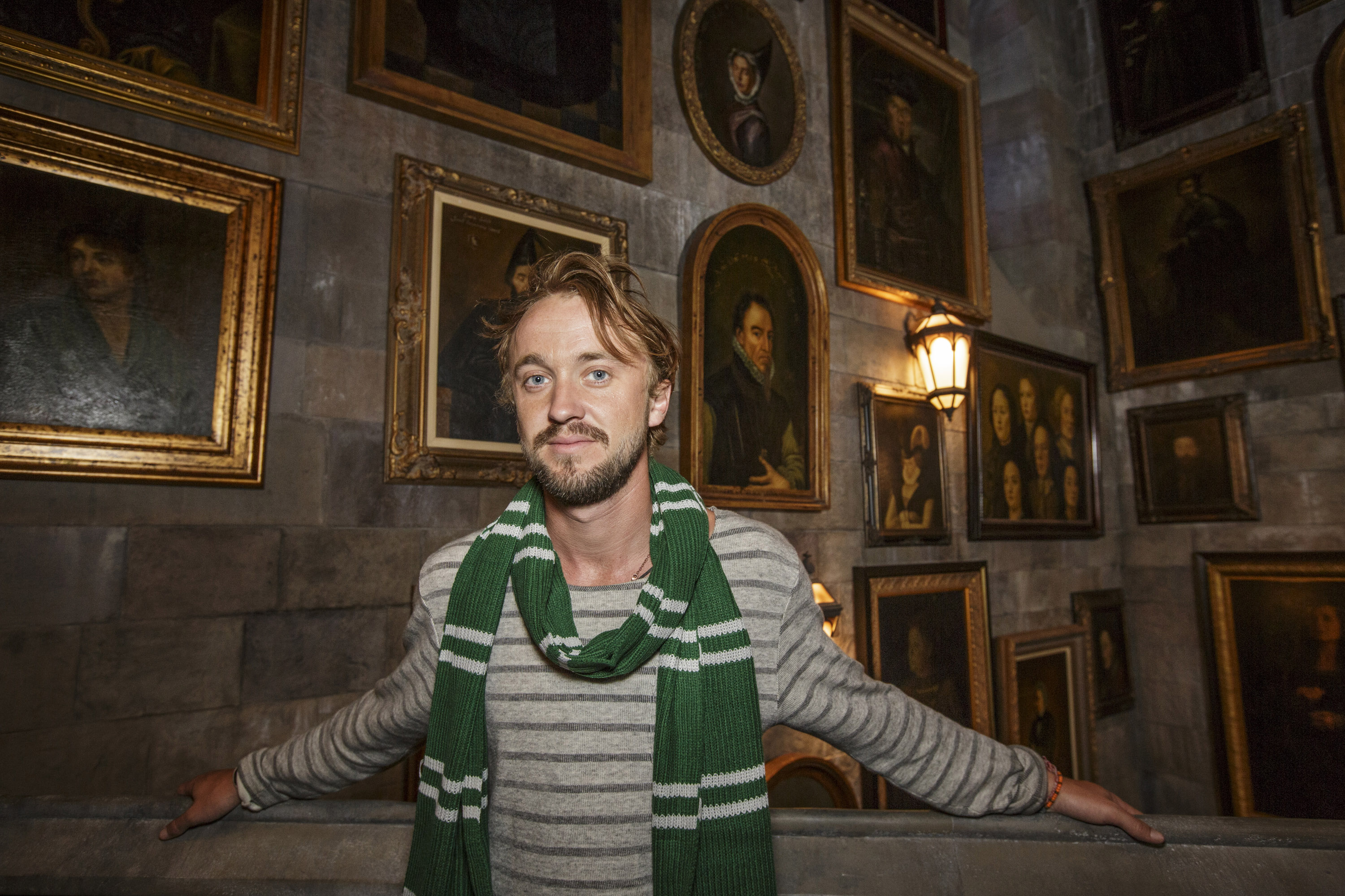 Tom Felton, who played Draco Malfoy, inside the Portrait Gallery in Hogwarts Castle.