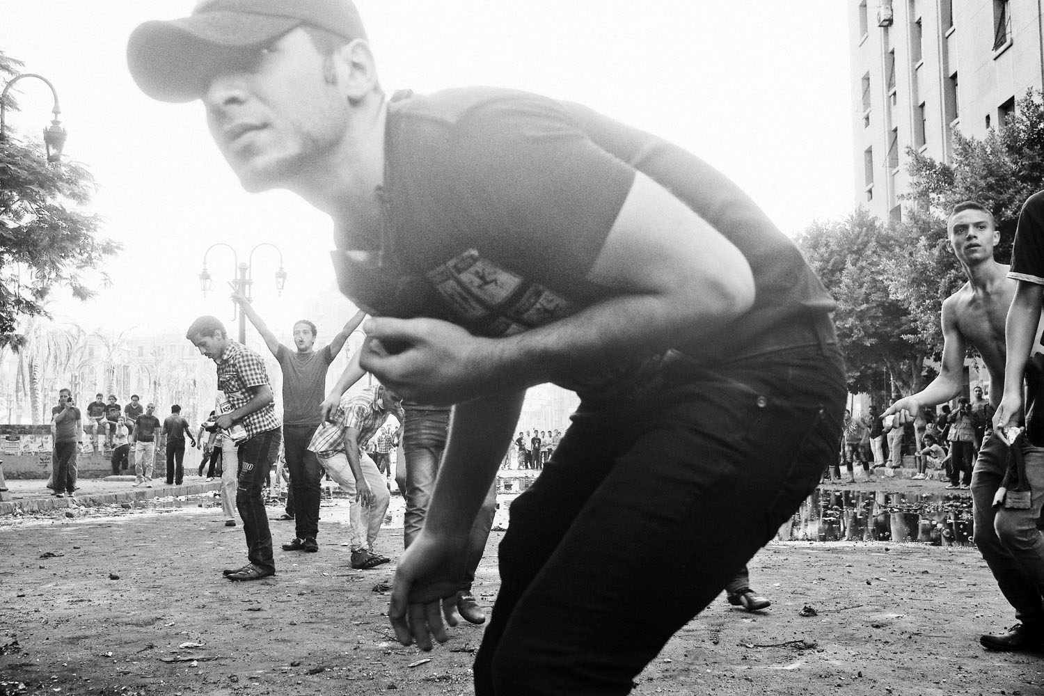 <i>The following photographs were taken on Sept. 13-14, 2012.</i><br />
Protestors throw rocks at Egyptian security forces protecting the area near the U.S. Embassy in Cairo.