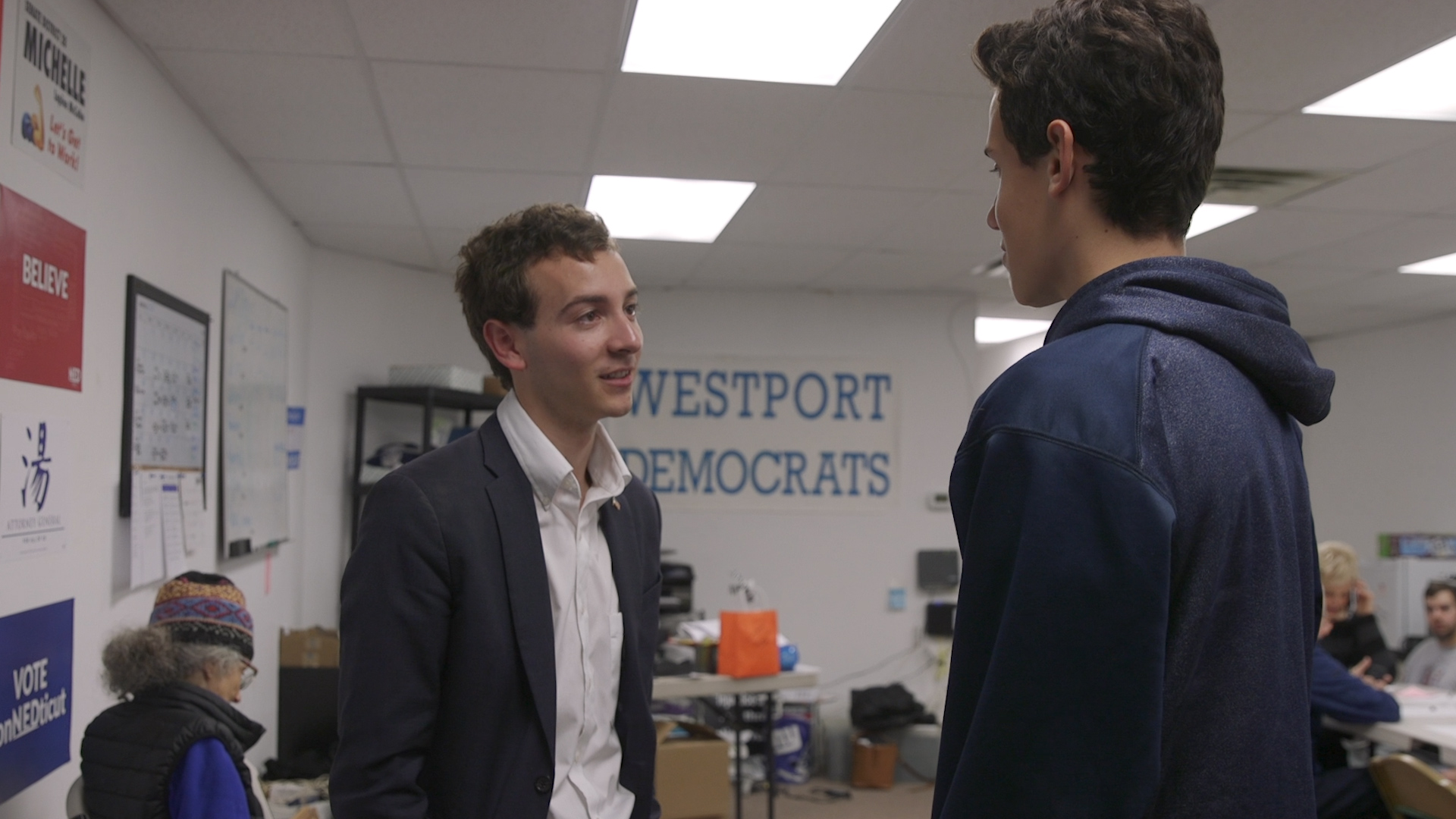 22-year-old Connnecticut state Senate candidate Will Haskell speaks with a campaign volunteer during a phone bank in Westport, CT on Oct. 30, 2018. 