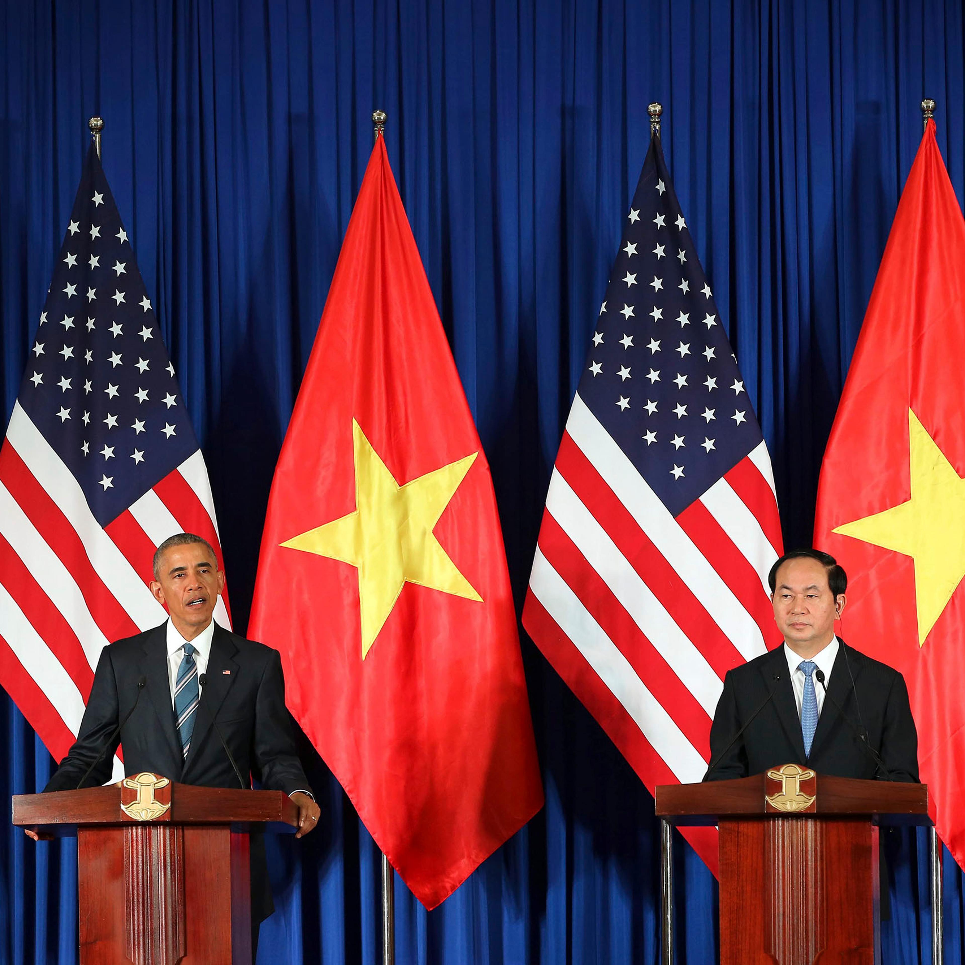 President Barack Obama and Vietnamese President Tran Dai Quang speak during a joint news conference at the International Convention Center in Hanoi, May 23, 2016.
