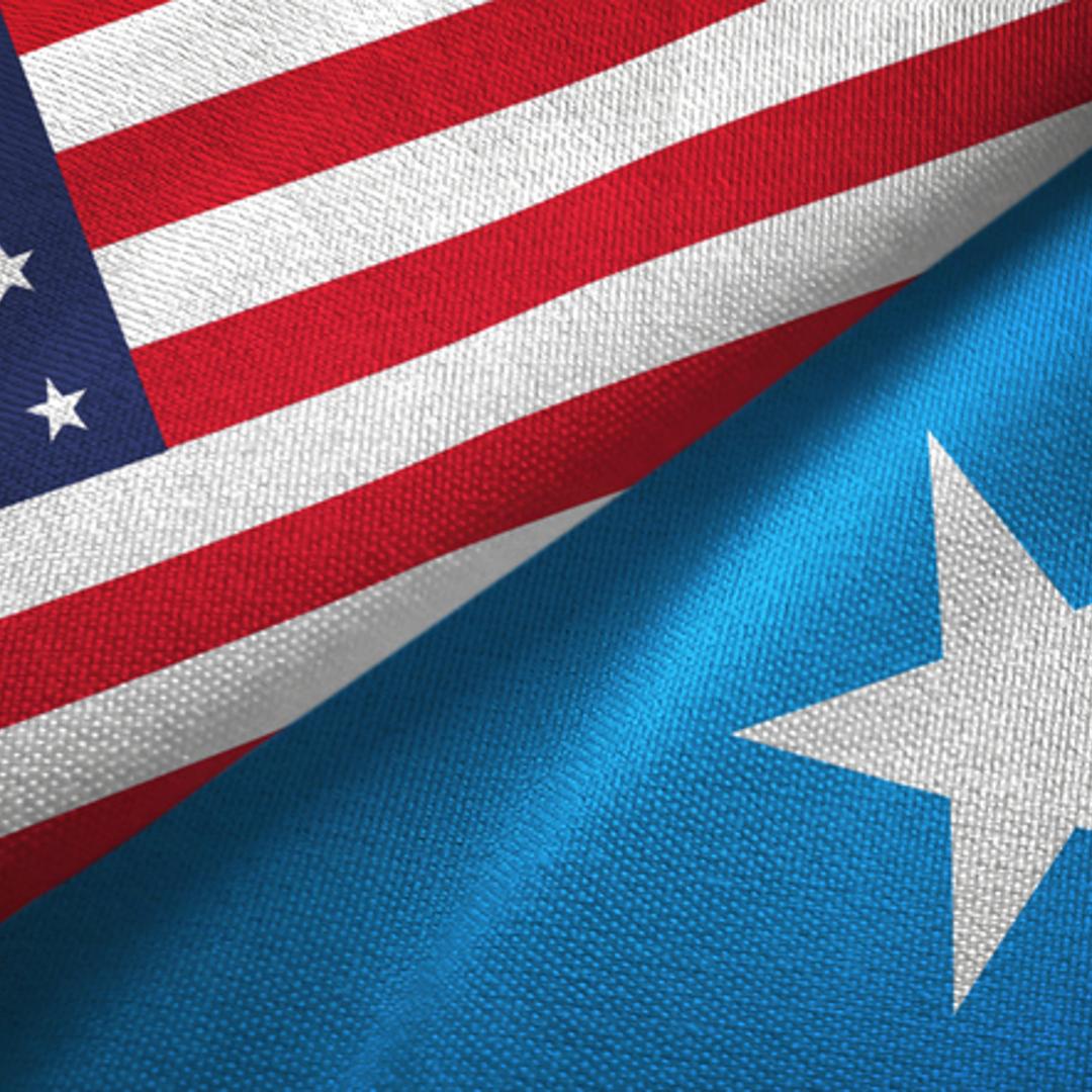 The flags of Somalia and the U.S.