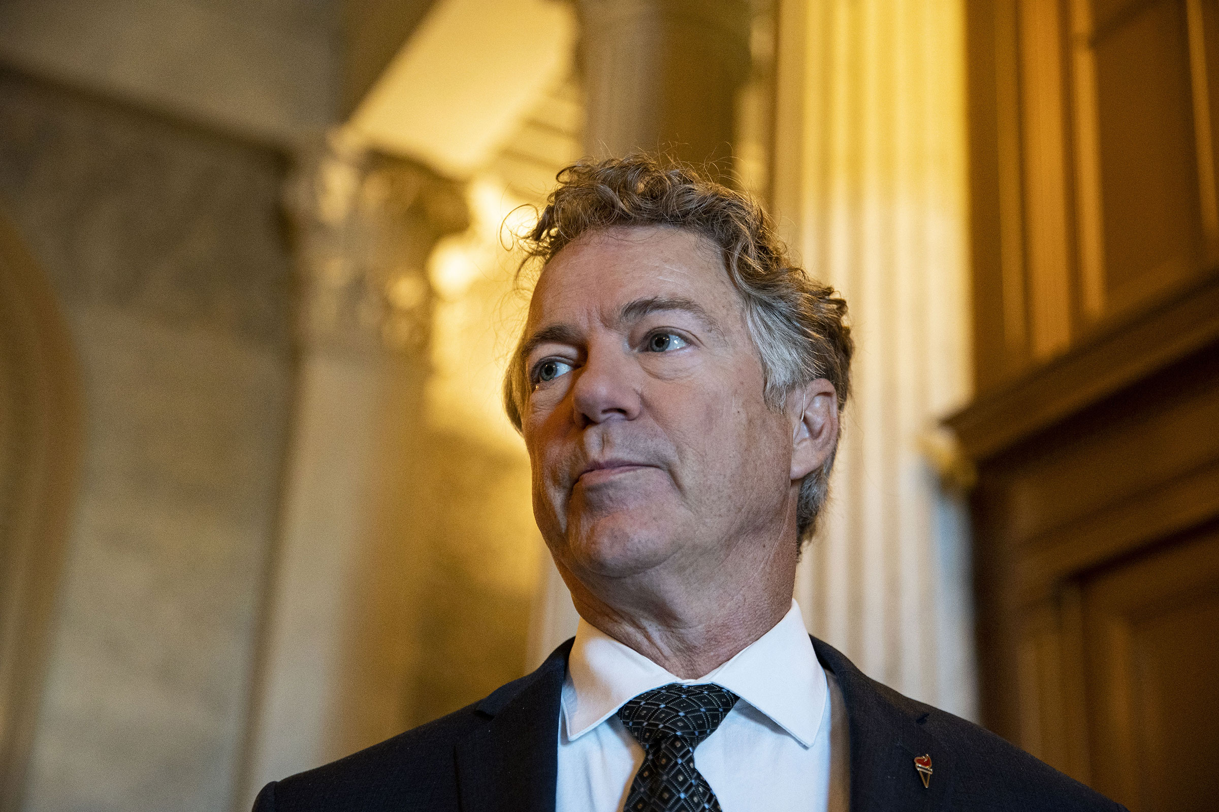 Senator Rand Paul speaks with members of the media following a vote in the Capitol in Washington, on Jan. 11, 2022.