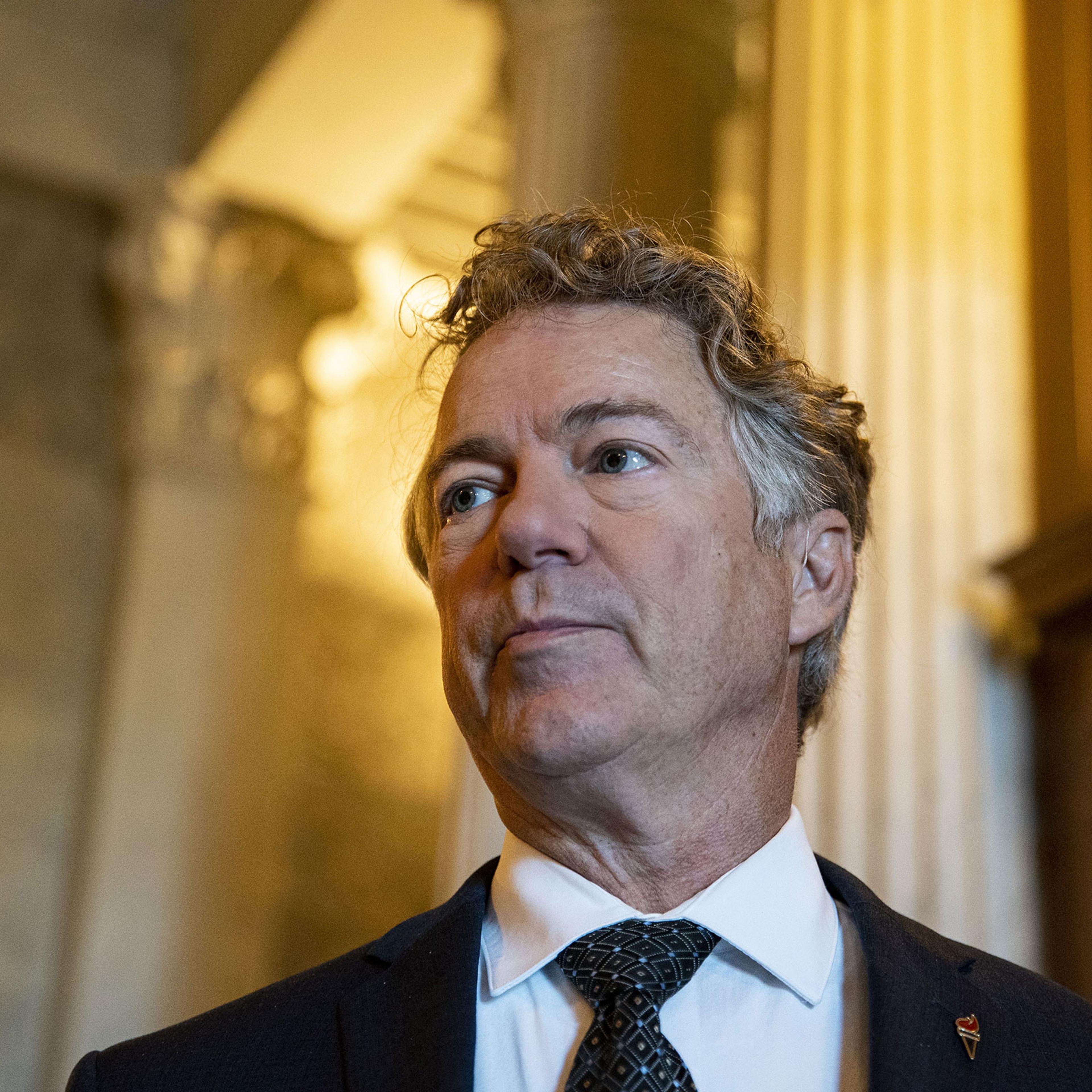 Senator Rand Paul speaks with members of the media following a vote in the Capitol in Washington, on Jan. 11, 2022.