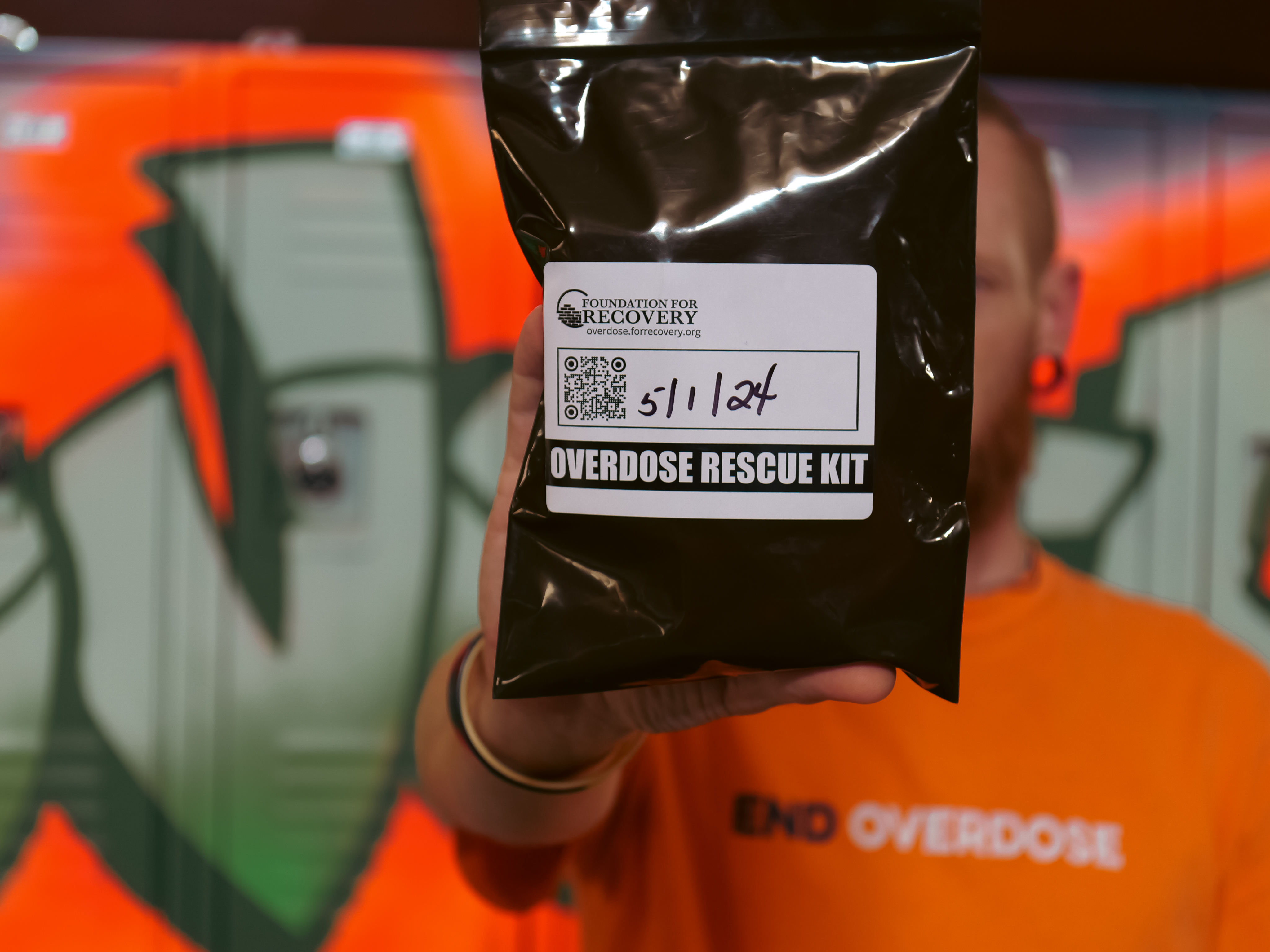 Overdose prevention ambassador and community trainer Chris Marx of Foundation for Recovery in Las Vegas holds an overdose rescue kit with the opioid overdose reversal medication, naloxone.