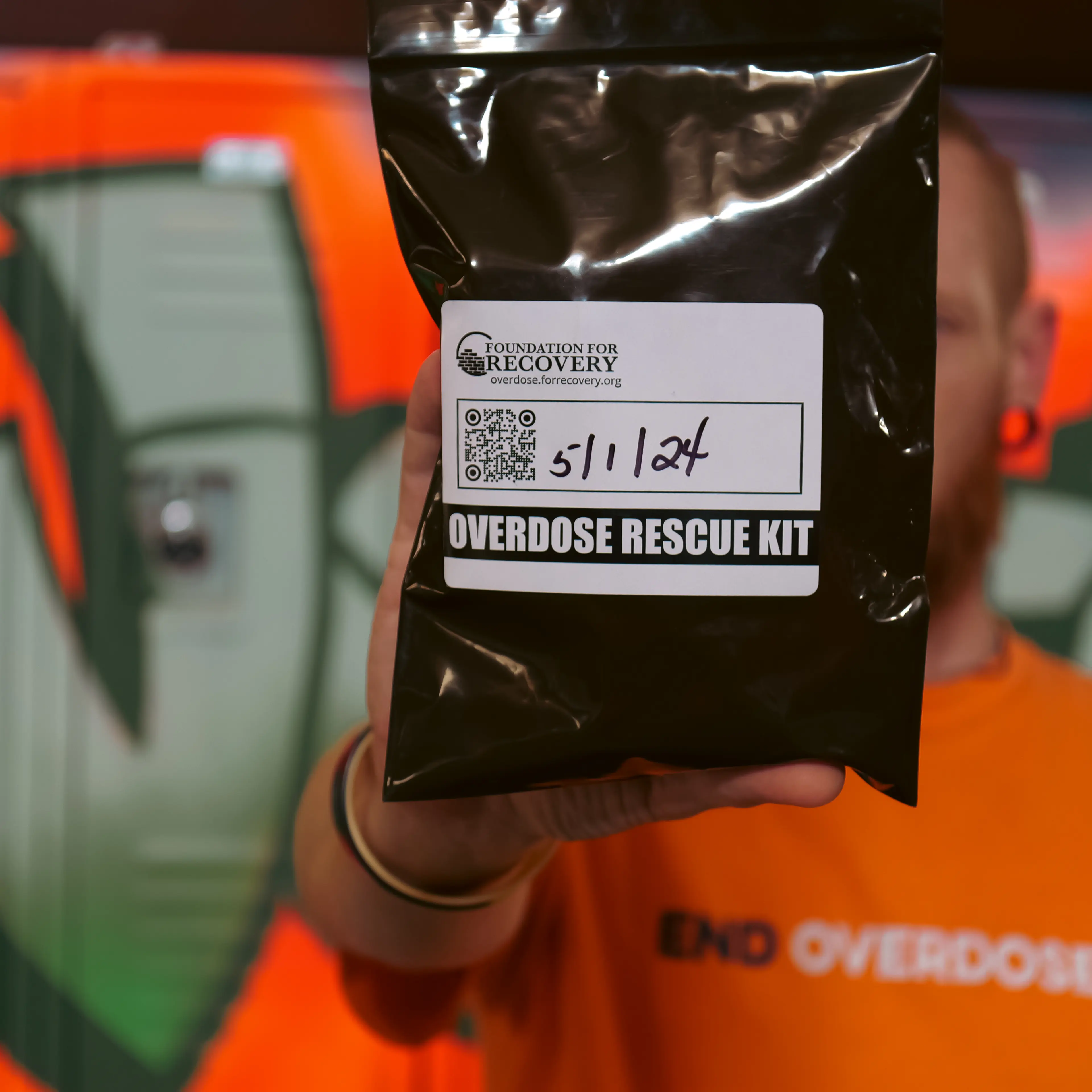 Overdose prevention ambassador and community trainer Chris Marx of Foundation for Recovery in Las Vegas holds an overdose rescue kit with the opioid overdose reversal medication, naloxone.