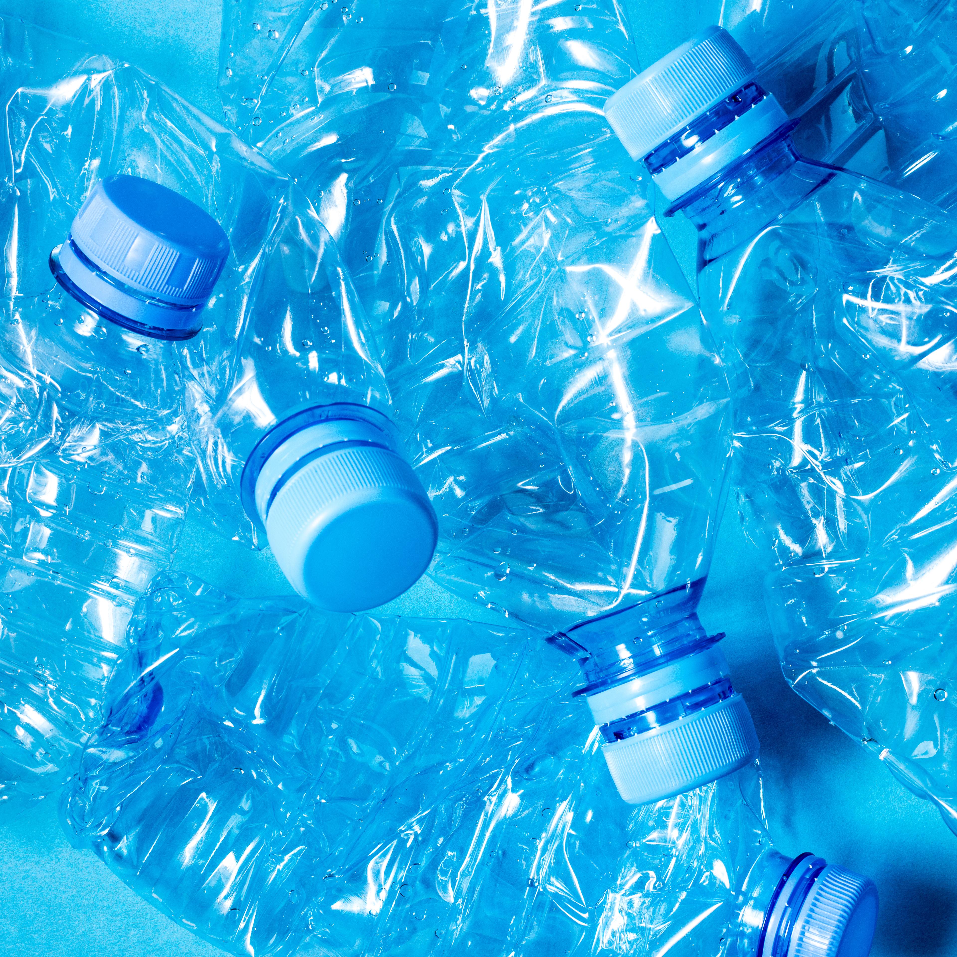Crumpled plastic bottles of mineral water.