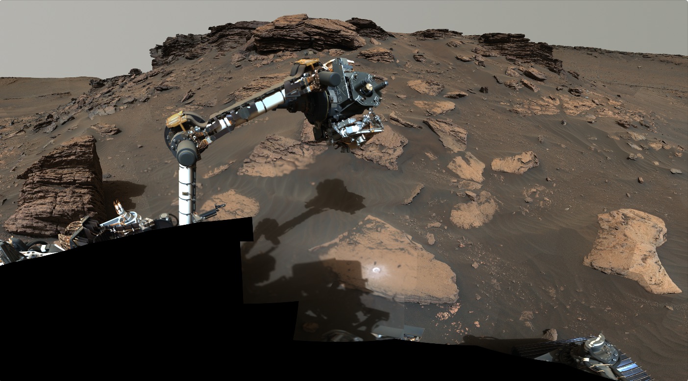 The Perseverance rover's robotic arm samples sedimentary material on Mars