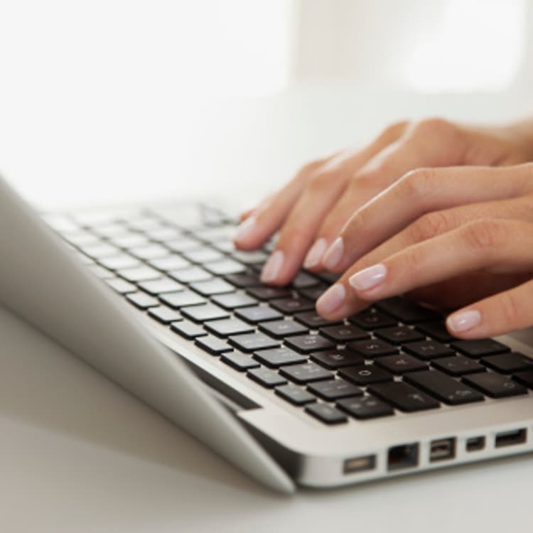 women-hands-typing-laptop