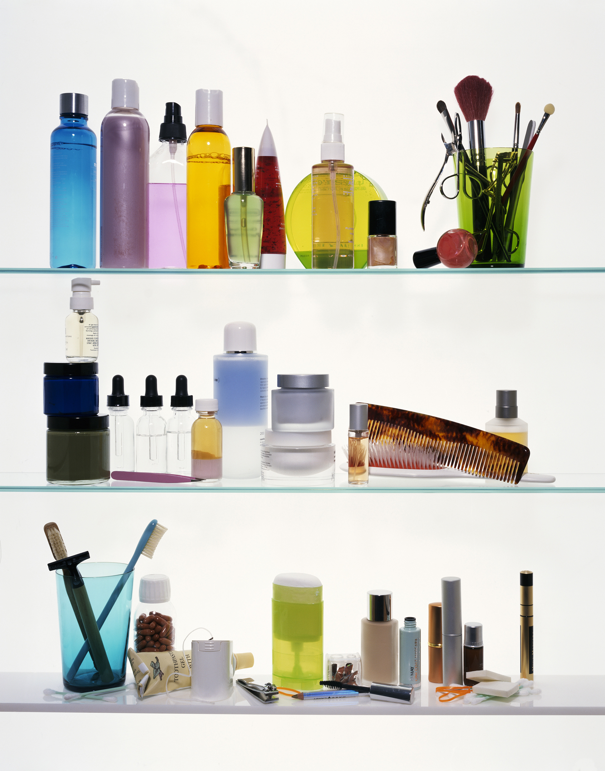 Toilet items sitting on shelves