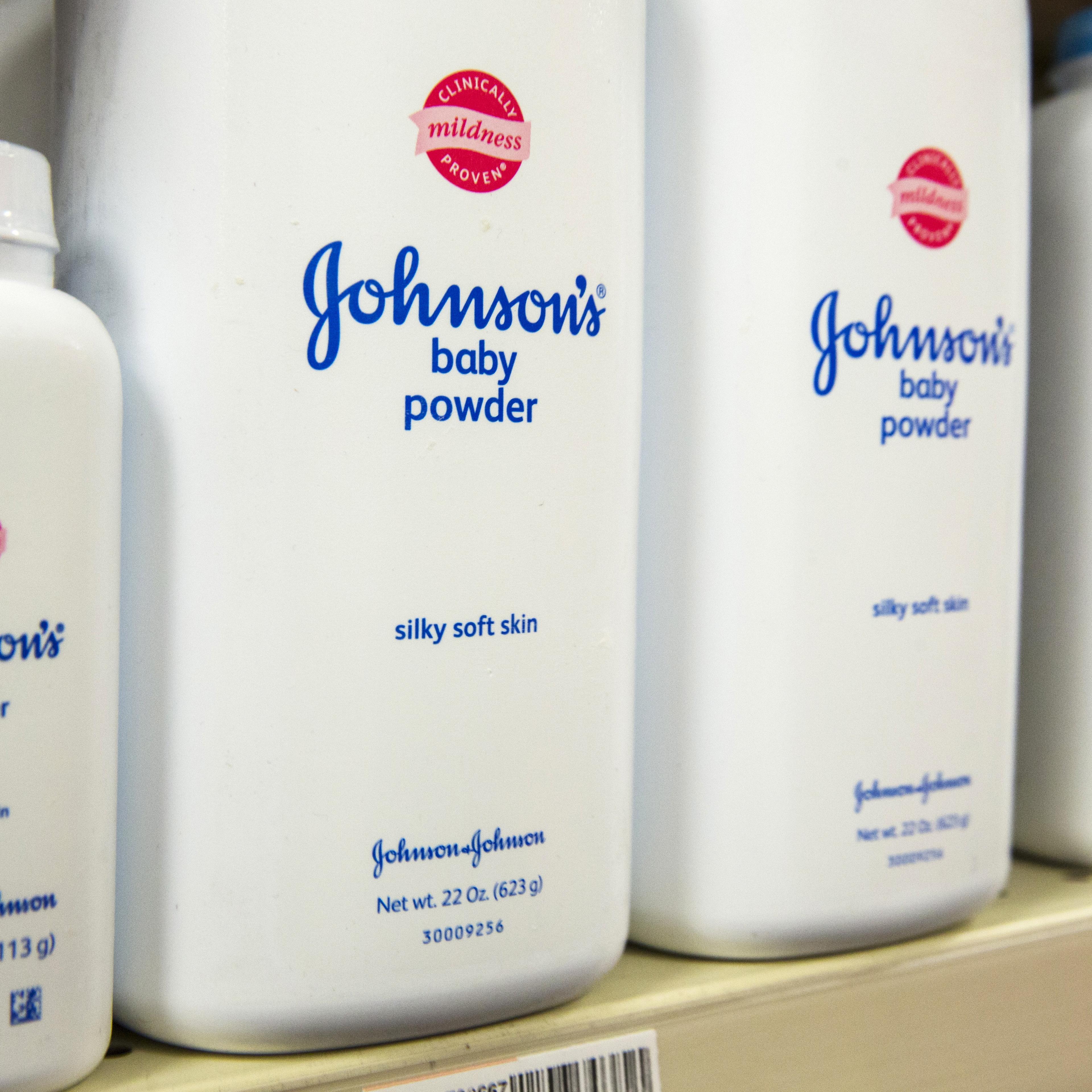 Bottles of Johnson & Johnson baby powder line a drugstore shelf in New York