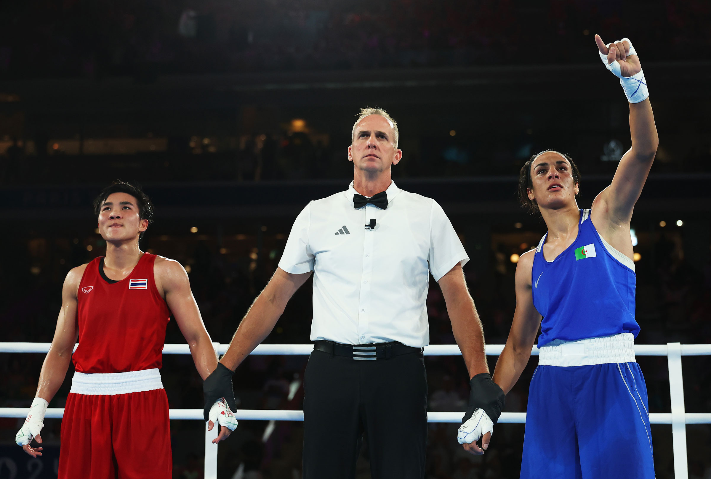 Match Referee Shawn Reese raises the arm of Imane Khelif of Team Algeria to announce the winner of the Women’s 66kg Semifinal