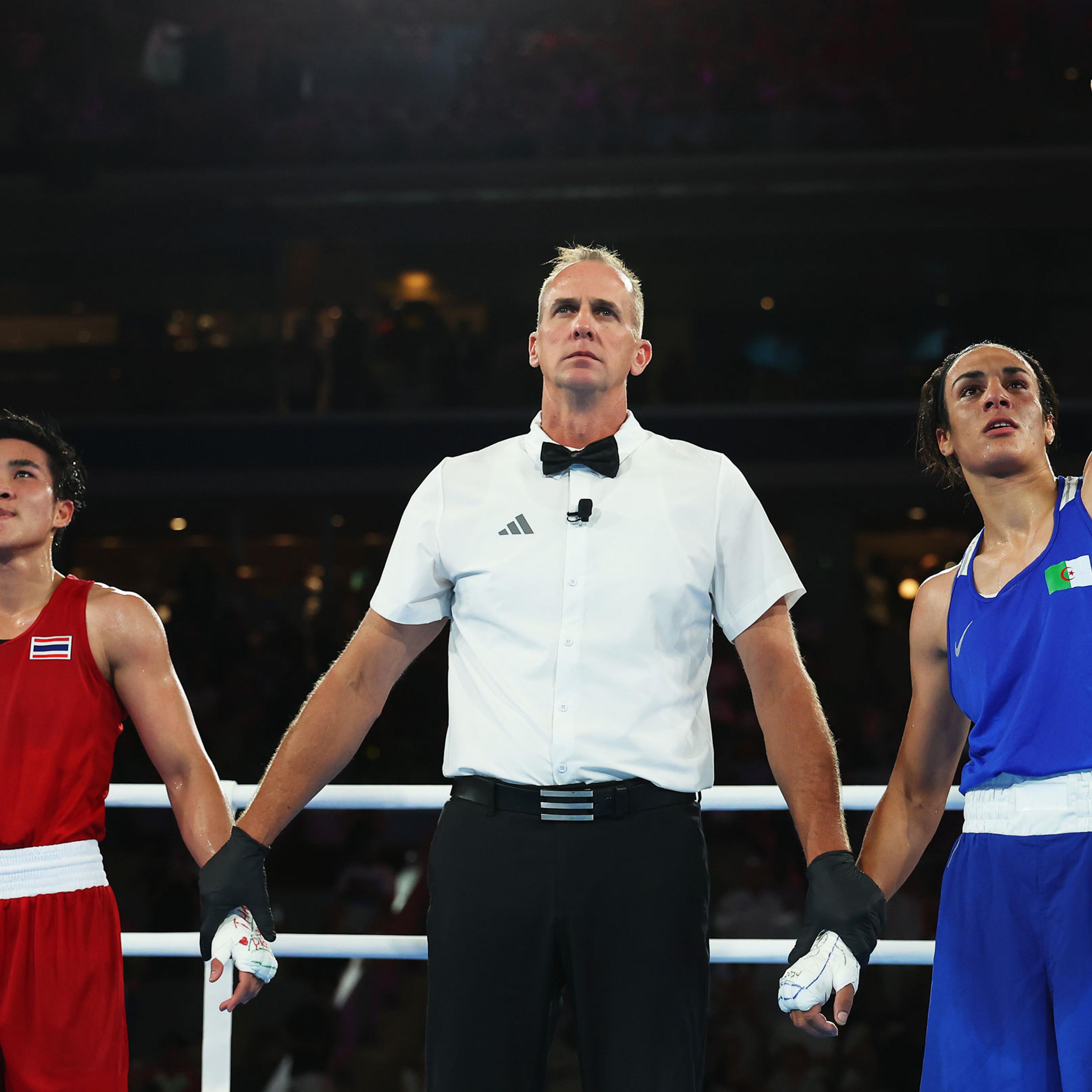 Match Referee Shawn Reese raises the arm of Imane Khelif of Team Algeria to announce the winner of the Women’s 66kg Semifinal