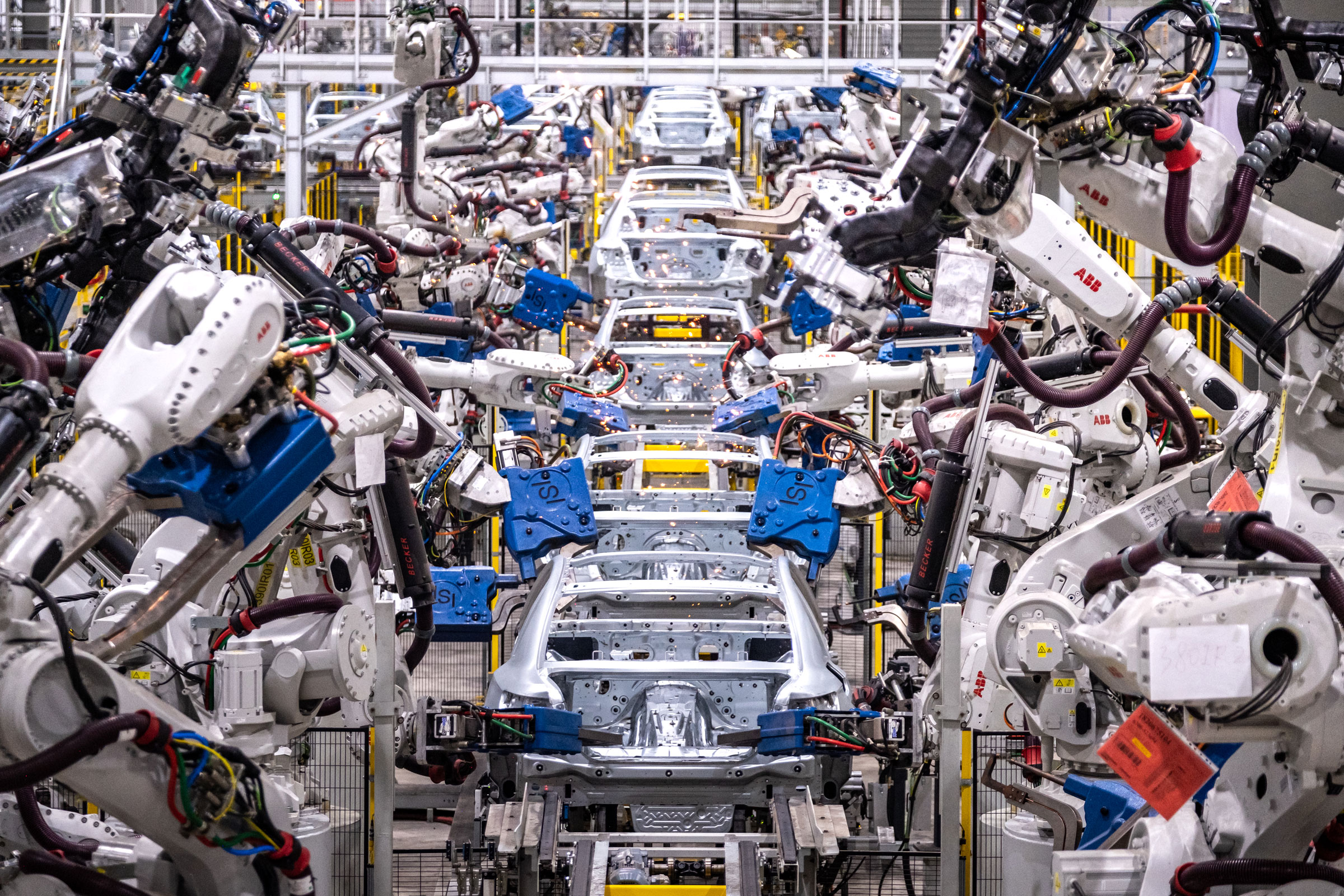 Assembly robots put together car bodies in the body shop at VinFast manufacturing plant in Haiphong, Vietnam