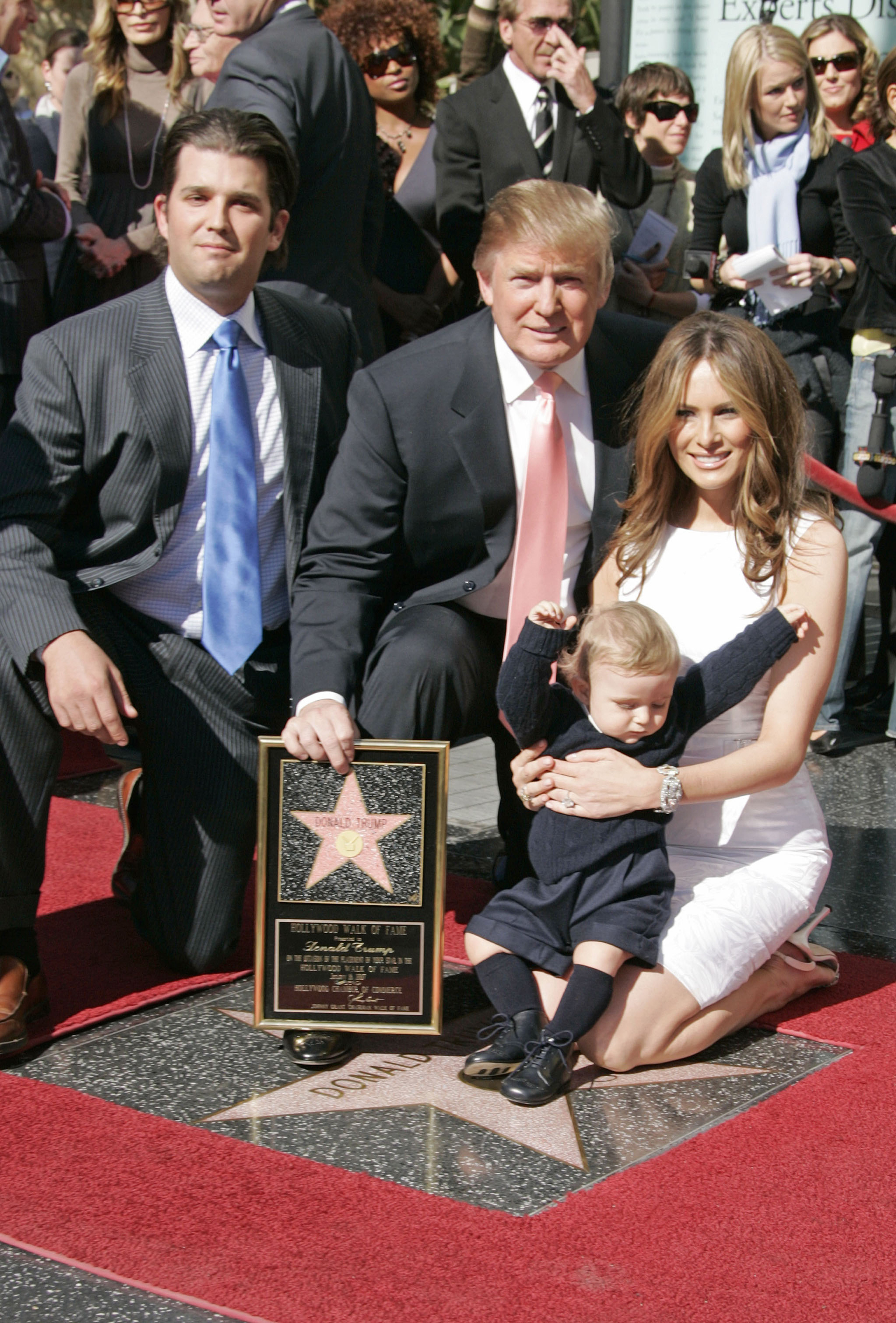 Donald Trump (C), Donald Trump jr. (L), Trump's 10 months old son Barron and wife Melania (R) pictured during a ceremony honouring Trump with a star on the Hollywood Walk of Fame in Los Angeles, on Jan 16, 2007.