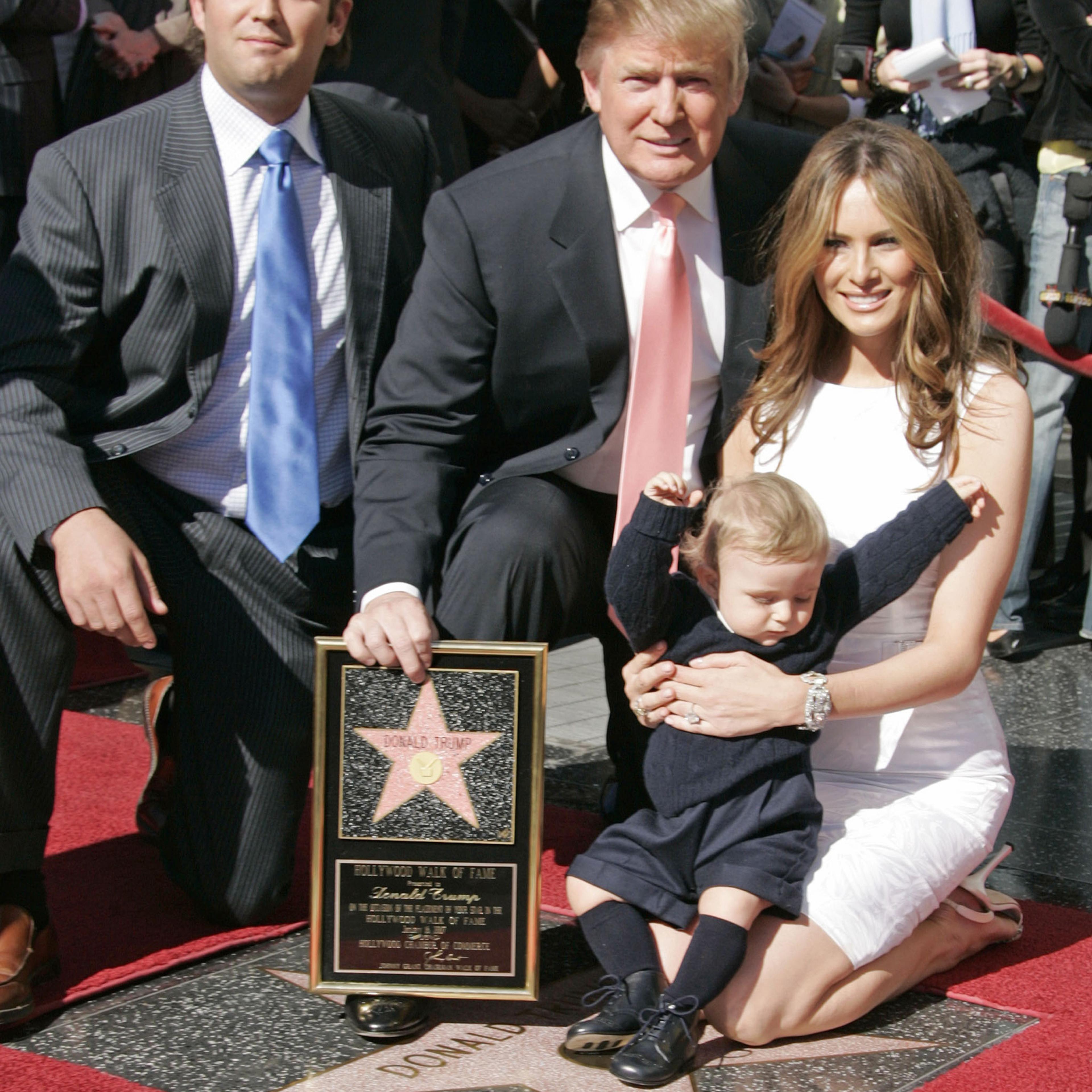 Donald Trump (C), Donald Trump jr. (L), Trump's 10 months old son Barron and wife Melania (R) pictured during a ceremony honouring Trump with a star on the Hollywood Walk of Fame in Los Angeles, on Jan 16, 2007.