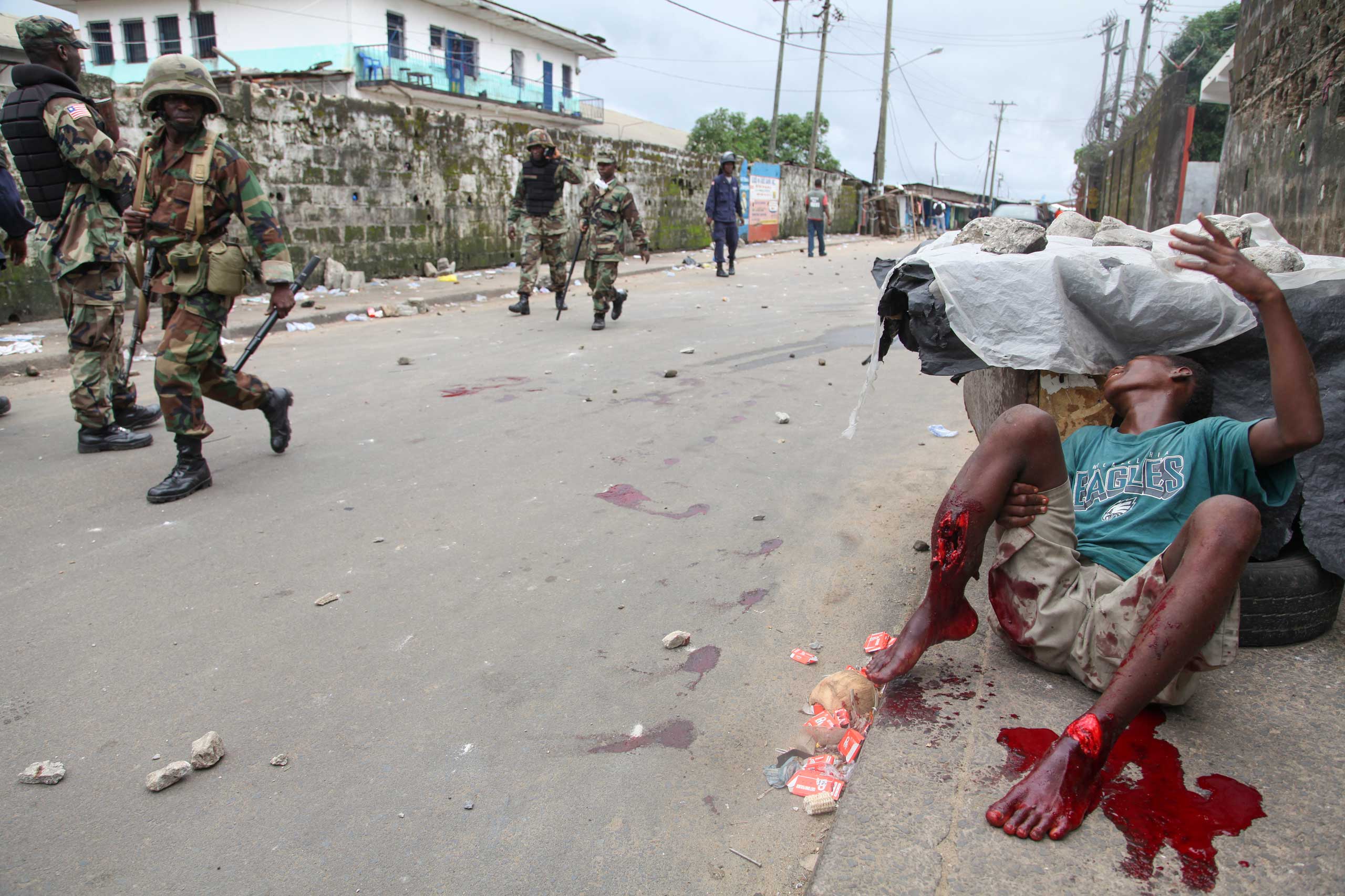 Ahmed Jallanzo, Aug. 20, 2014. Monrovia, Liberia."Violence had broken out in the slum township of West Point as the government tried to quarantine tens of thousands of residents in order to stop the spread of the deadly Ebola virus. As I walked through t