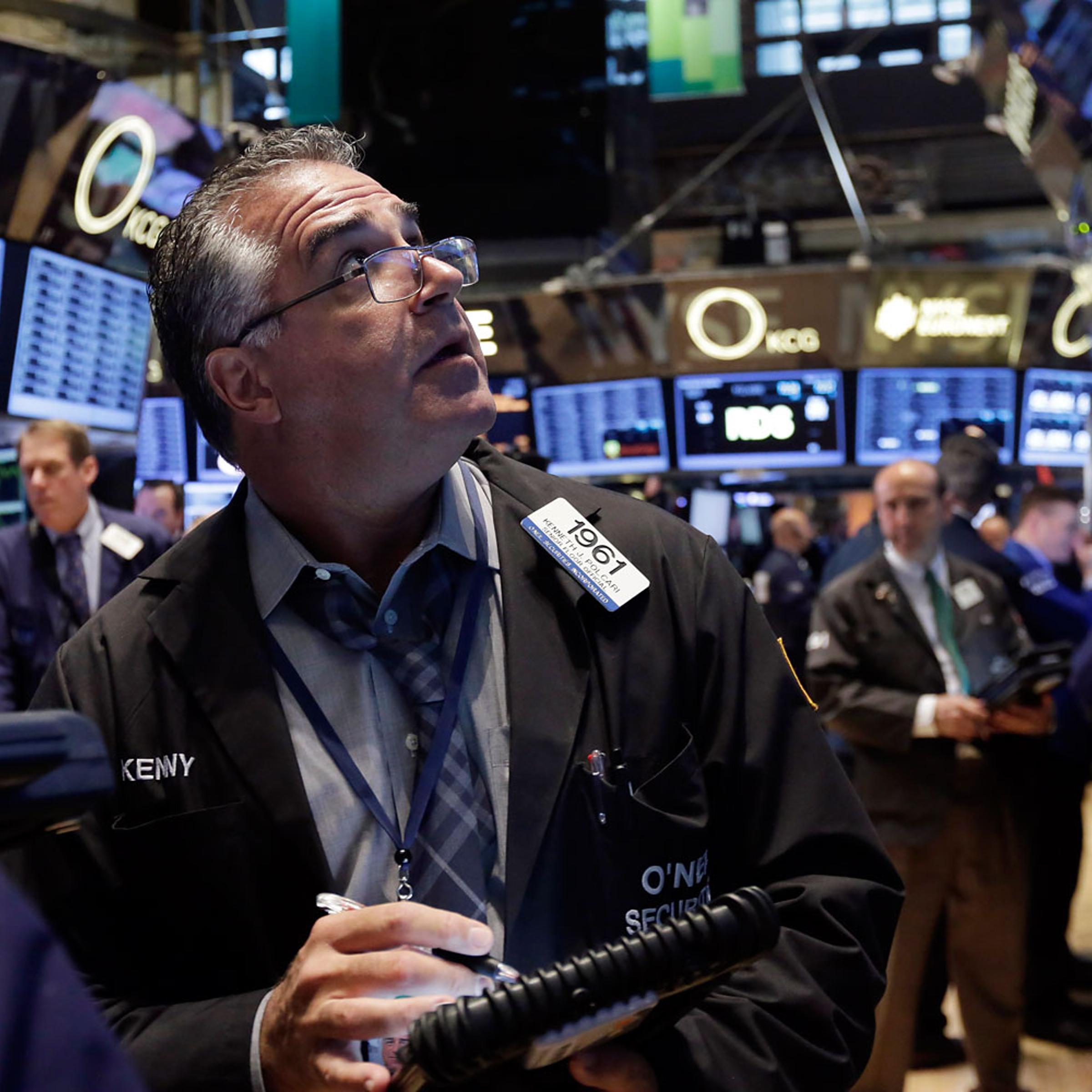 Trader Kenneth Polcari works on the floor of the New York Stock Exchange Thursday, March 13, 2014.
