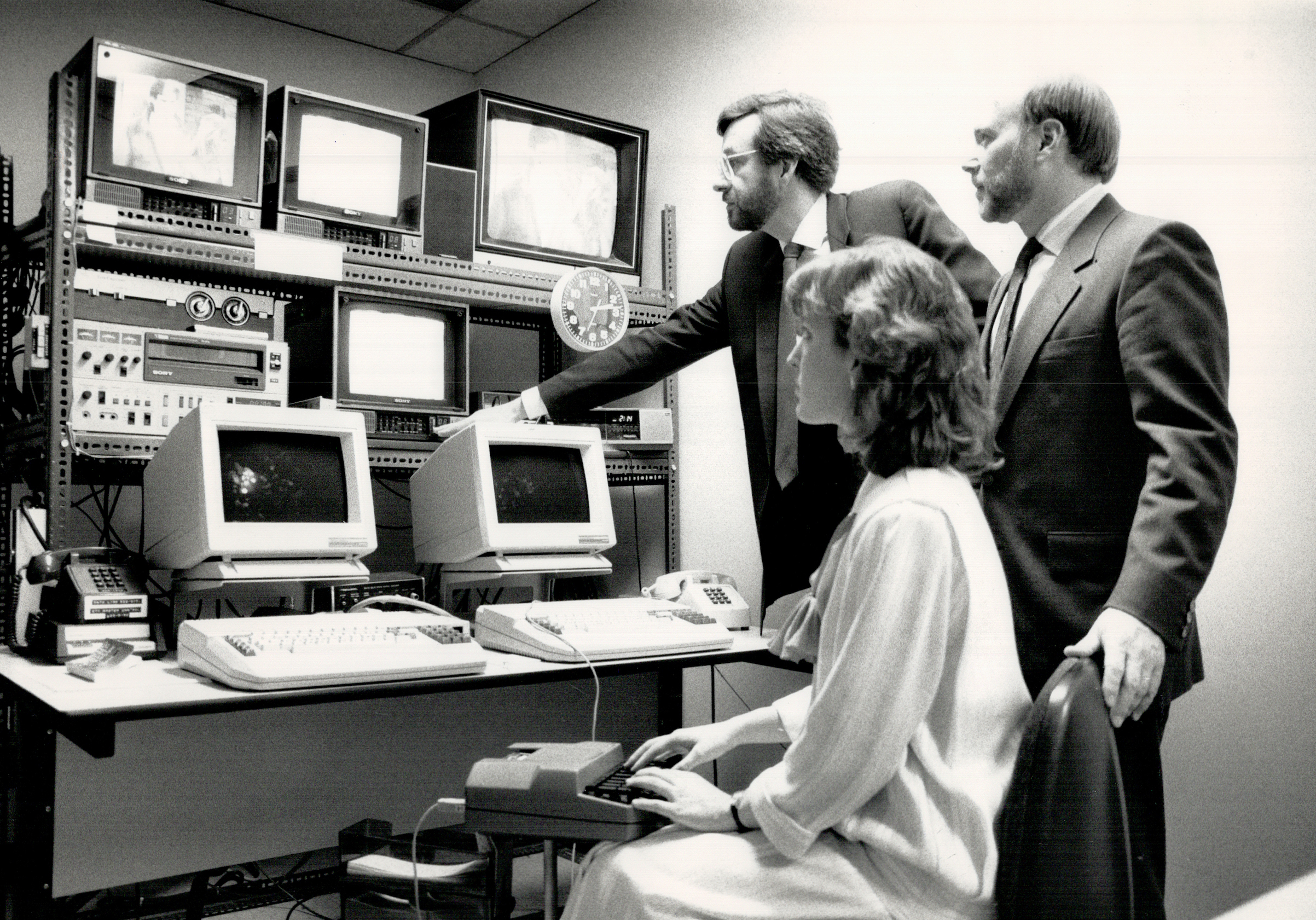 Monitoring their work: Bob Reaume, left, Canadian Captioning Development Agency consultant, Sanderso