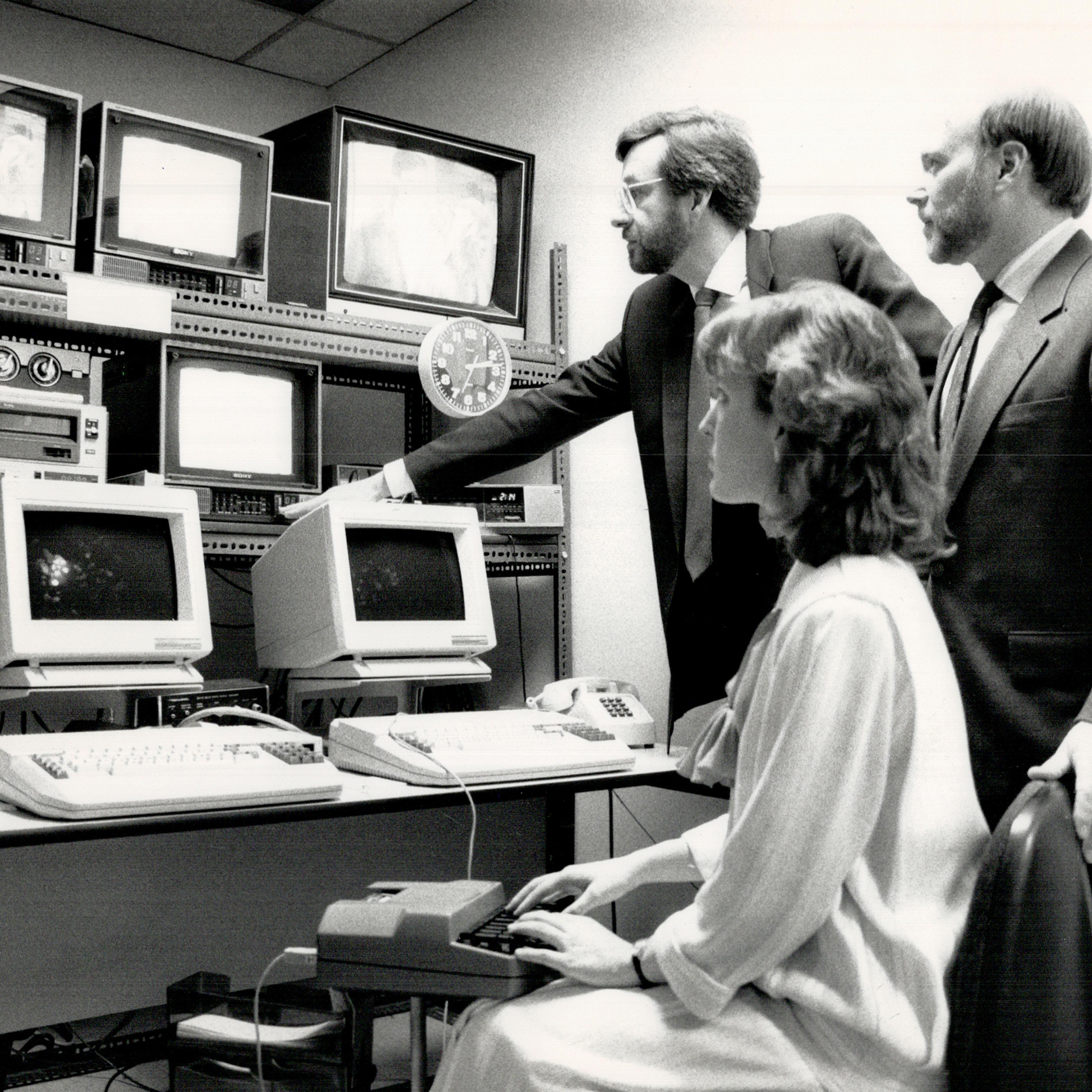 Monitoring their work: Bob Reaume, left, Canadian Captioning Development Agency consultant, Sanderso