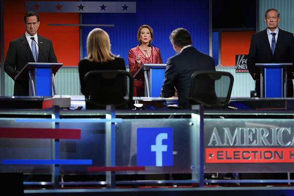 Republican presidential candidates (L-R) Rick Santorum, Carly Fiorina and George Pataki participate in a presidential pre-debate forum hosted by FOX News and Facebook at the Quicken Loans Arena August 6, 2015 in Cleveland, Ohio.