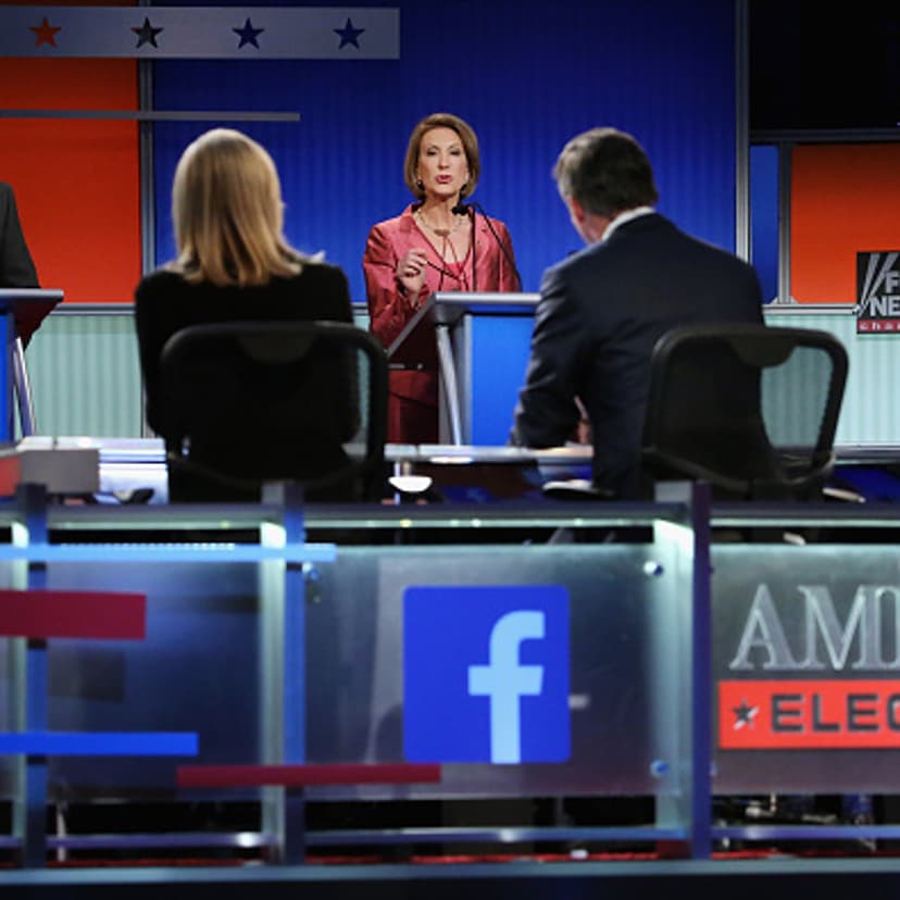 Republican presidential candidates (L-R) Rick Santorum, Carly Fiorina and George Pataki participate in a presidential pre-debate forum hosted by FOX News and Facebook at the Quicken Loans Arena August 6, 2015 in Cleveland, Ohio.