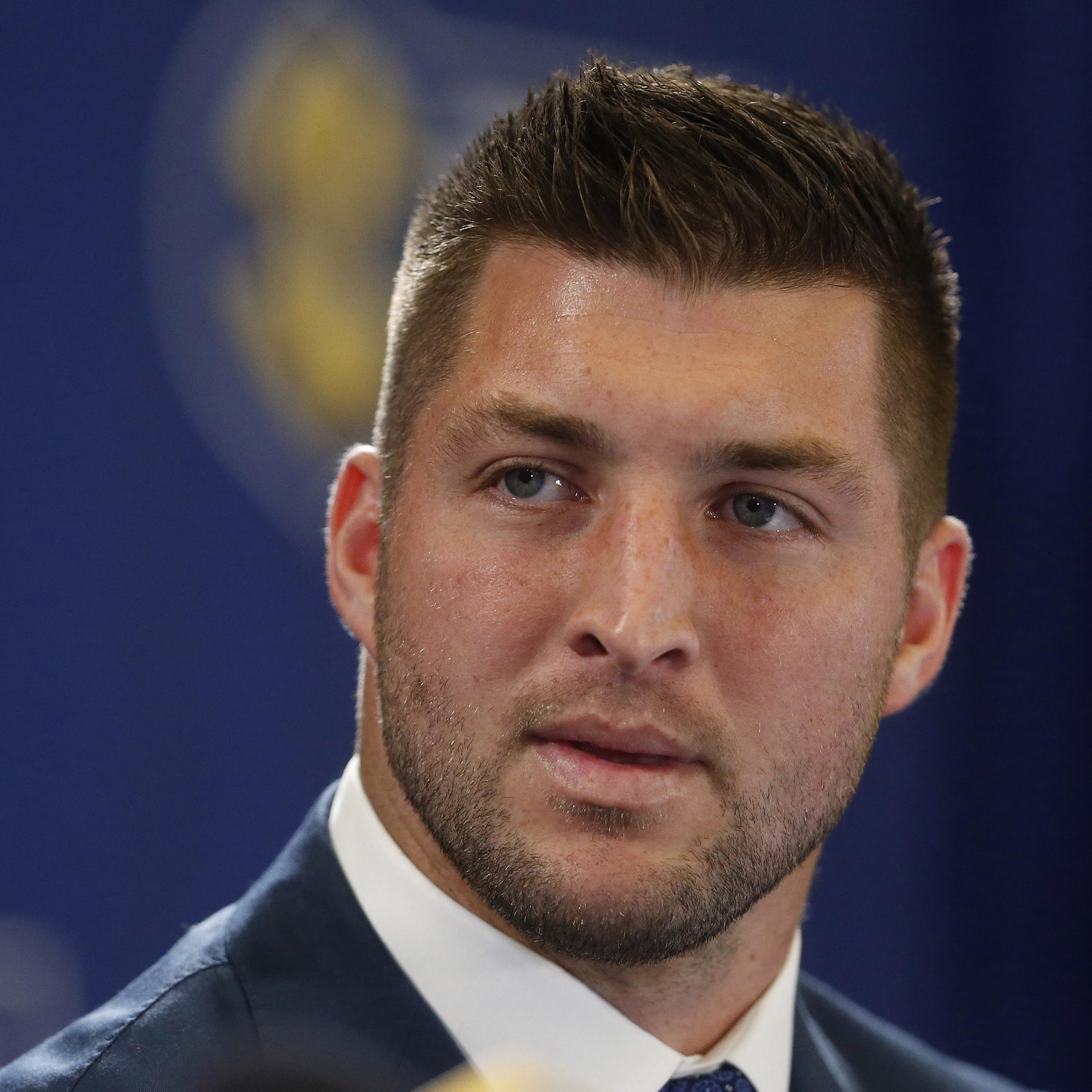 Tim Tebow speaks during a television broadcast in Atlanta on Dec. 5, 2014.
