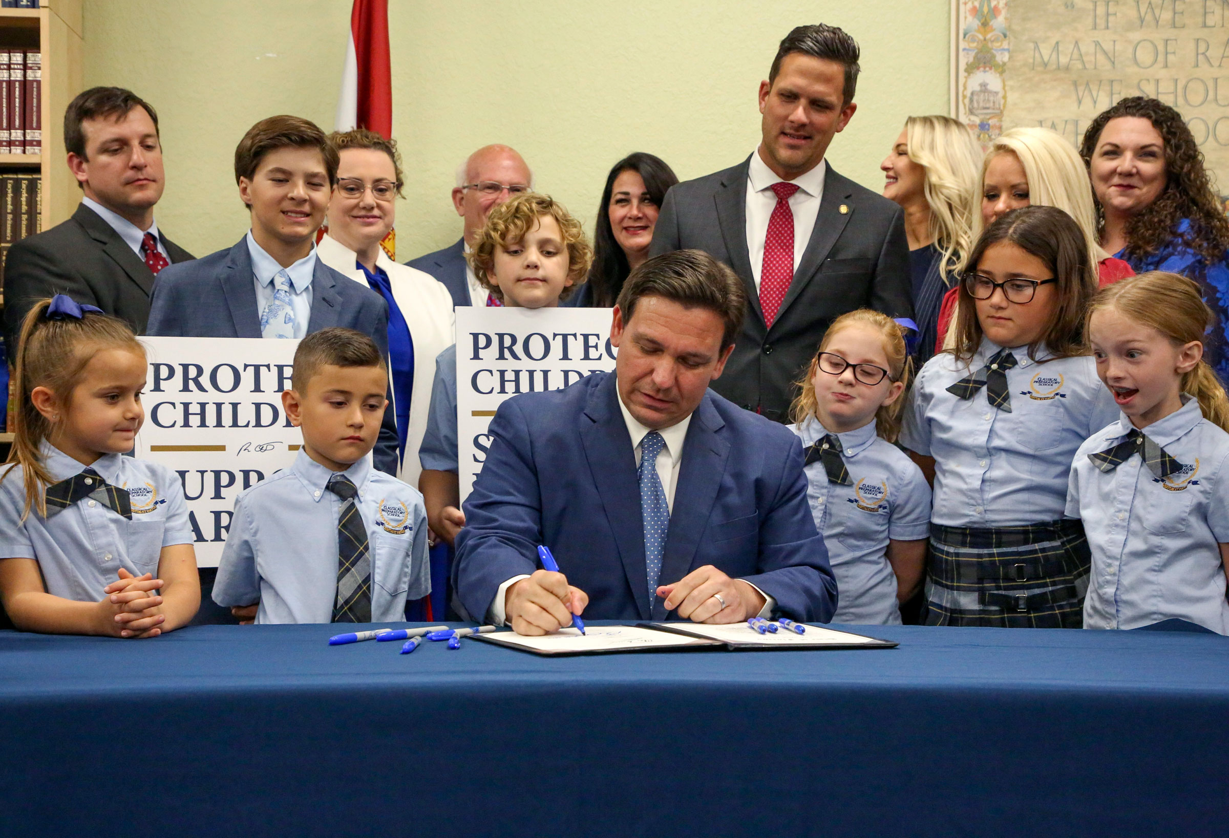 Florida Gov. Ron DeSantis signs the Parental Rights in Education bill at Classical Preparatory school in Shady Hills, Fla., on March 28, 2022.