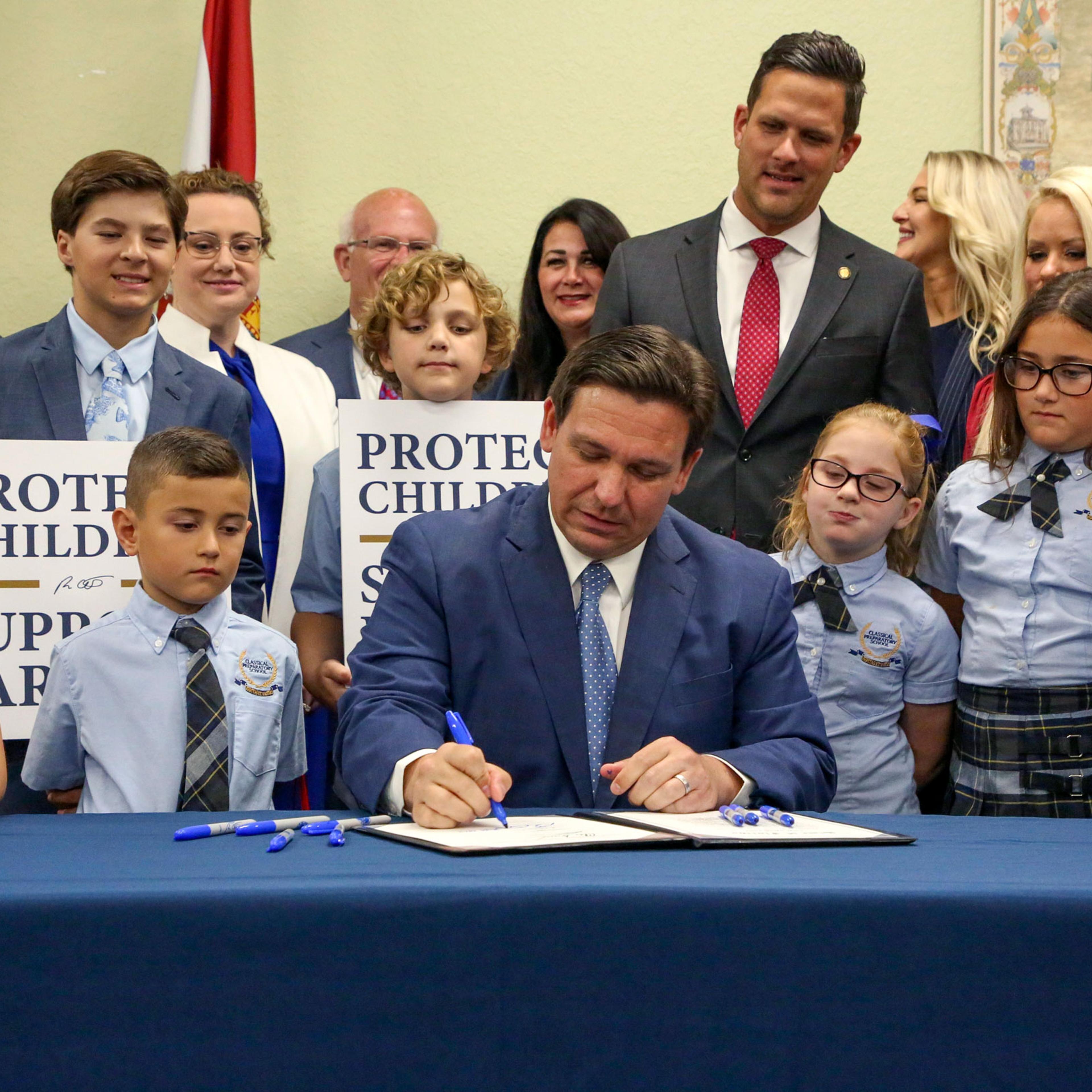 Florida Gov. Ron DeSantis signs the Parental Rights in Education bill at Classical Preparatory school in Shady Hills, Fla., on March 28, 2022.