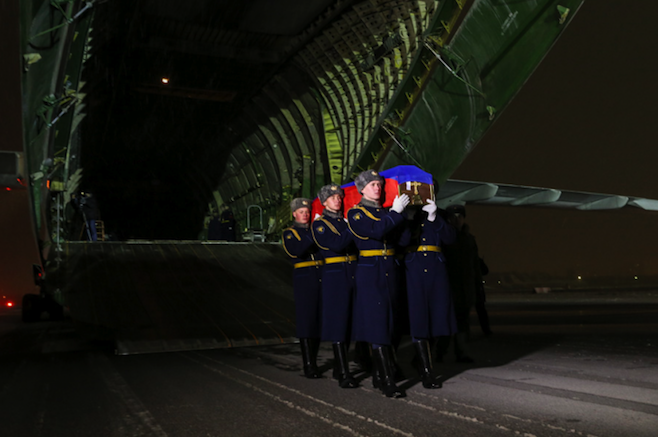 The body of Russian pilot Oleg Peshkov arrived in Moscow on Monday.