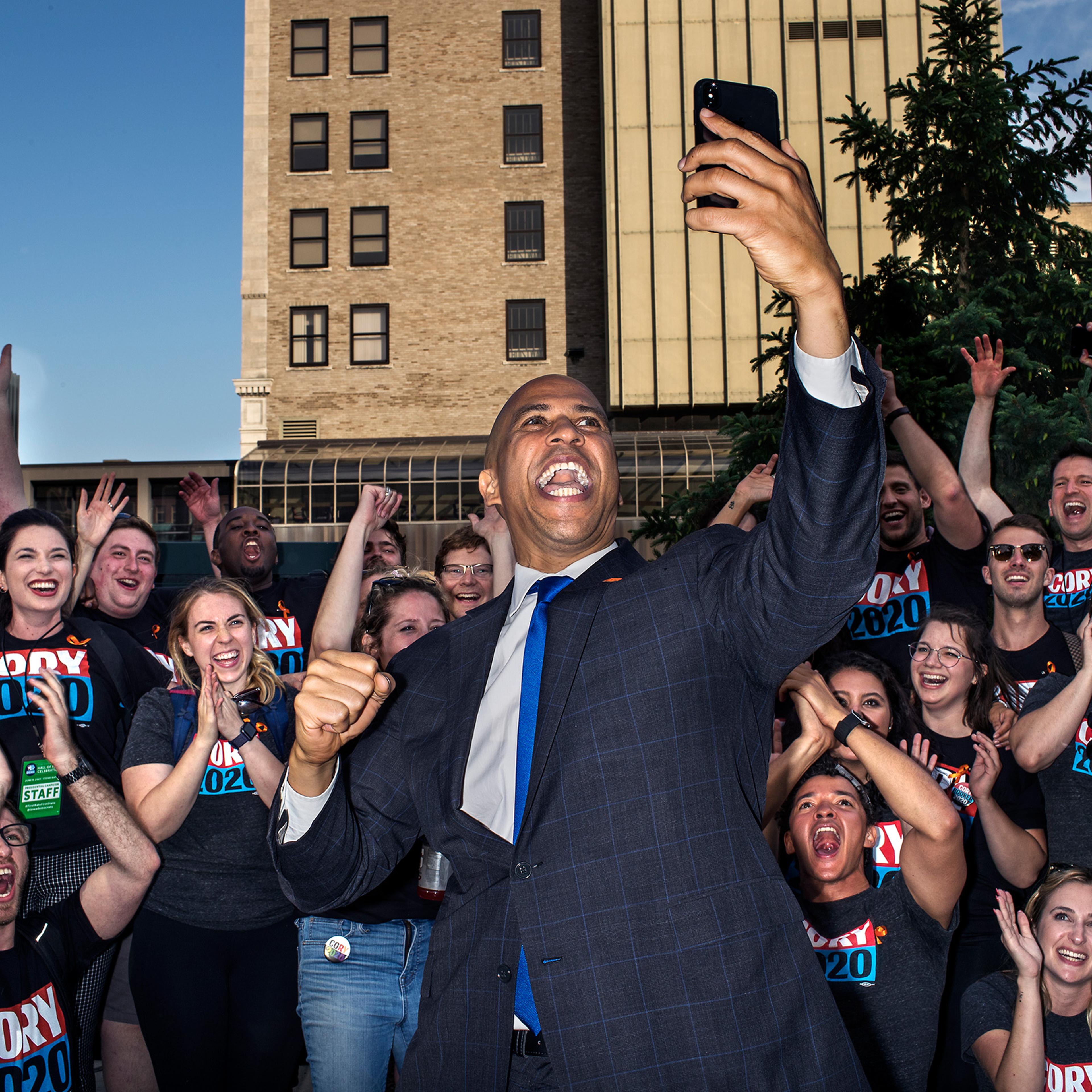 Senator Cory Booker records a video with supporters, staff, and volunteers after the Democratic Hall of Fame event