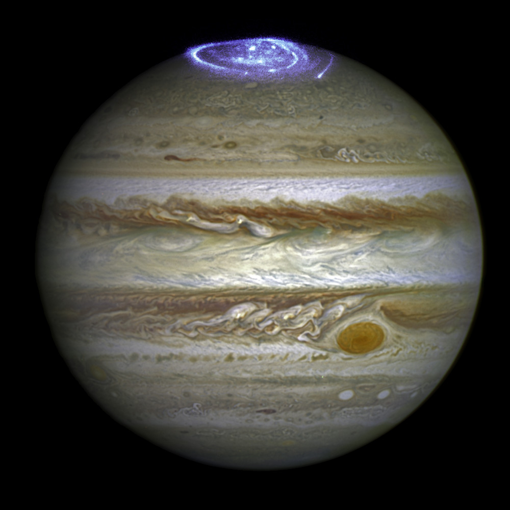 This image combines an image taken with Hubble Space Telescope in the optical (taken in spring 2014) and observations of its auroras in the ultraviolet, taken in 2016.
