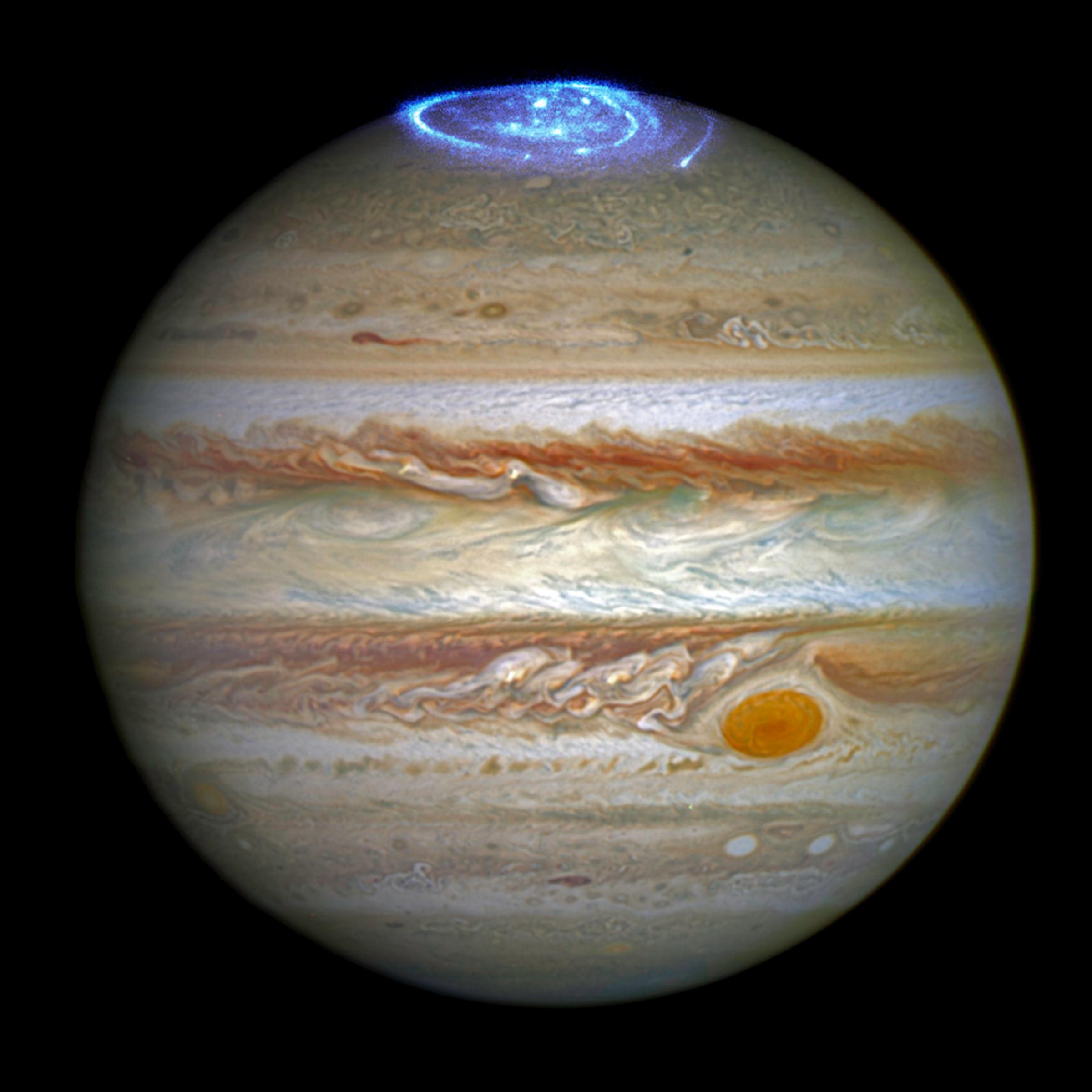 This image combines an image taken with Hubble Space Telescope in the optical (taken in spring 2014) and observations of its auroras in the ultraviolet, taken in 2016.