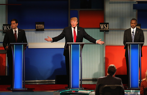 Presidential candidate Donald Trump (C) speaks while Sen. Marco Rubio (L) (R-FL), and Ben Carson look on during the Republican Presidential Debate sponsored by Fox Business and the Wall Street Journal at the Milwaukee Theatre November 10, 2015 in Milwauk