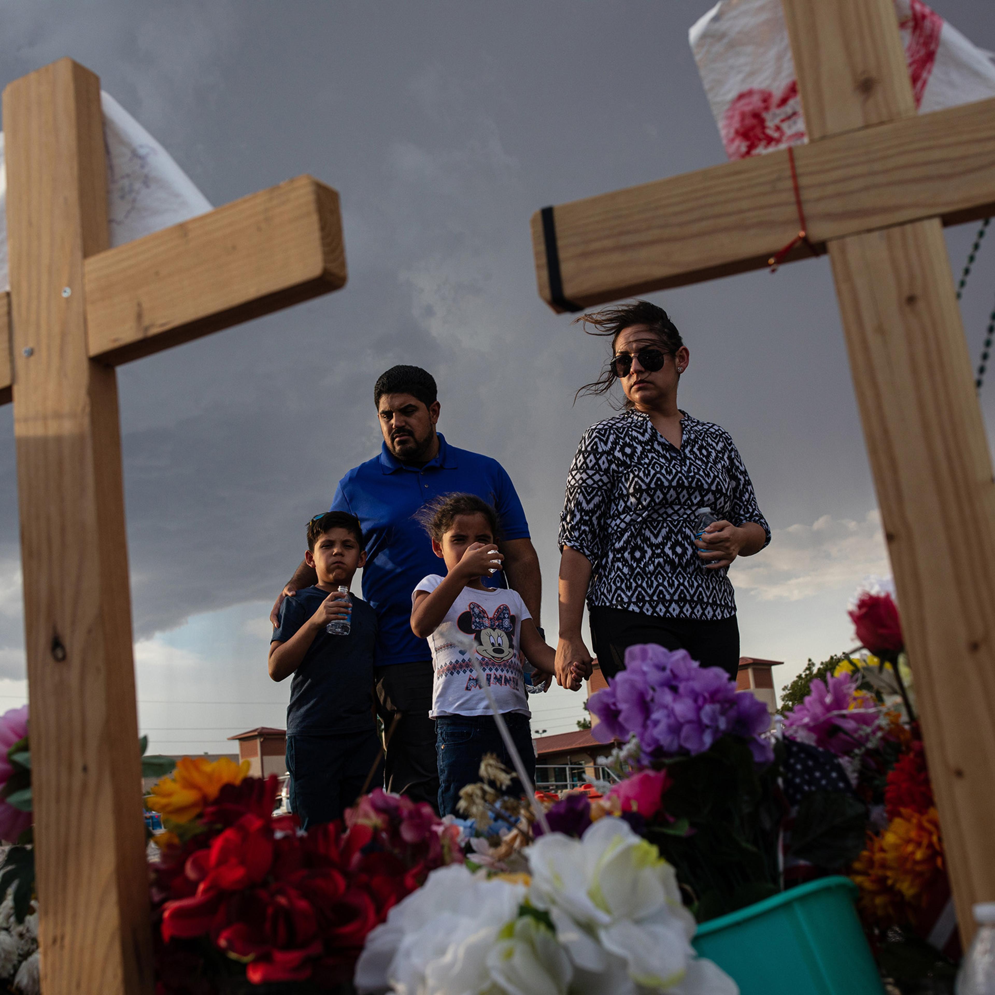 The Valenzuela family visits a makeshift memorial for victims of the shooting that killed 22 people at a Walmart store, in El Paso, Texas, Aug. 27, 2019. (Tamir Kalifa/The New York Times)