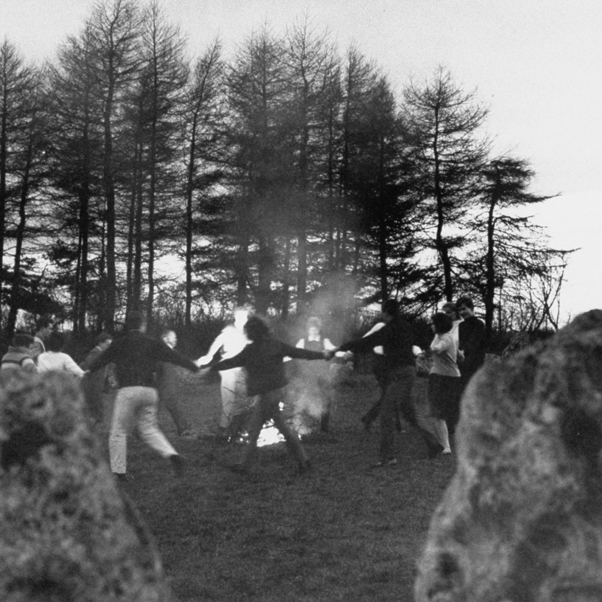 In a thousand-year-old rite, the witches dance around bonfire within prehistoric Rollright stone circle that stands in Oxfordshire.