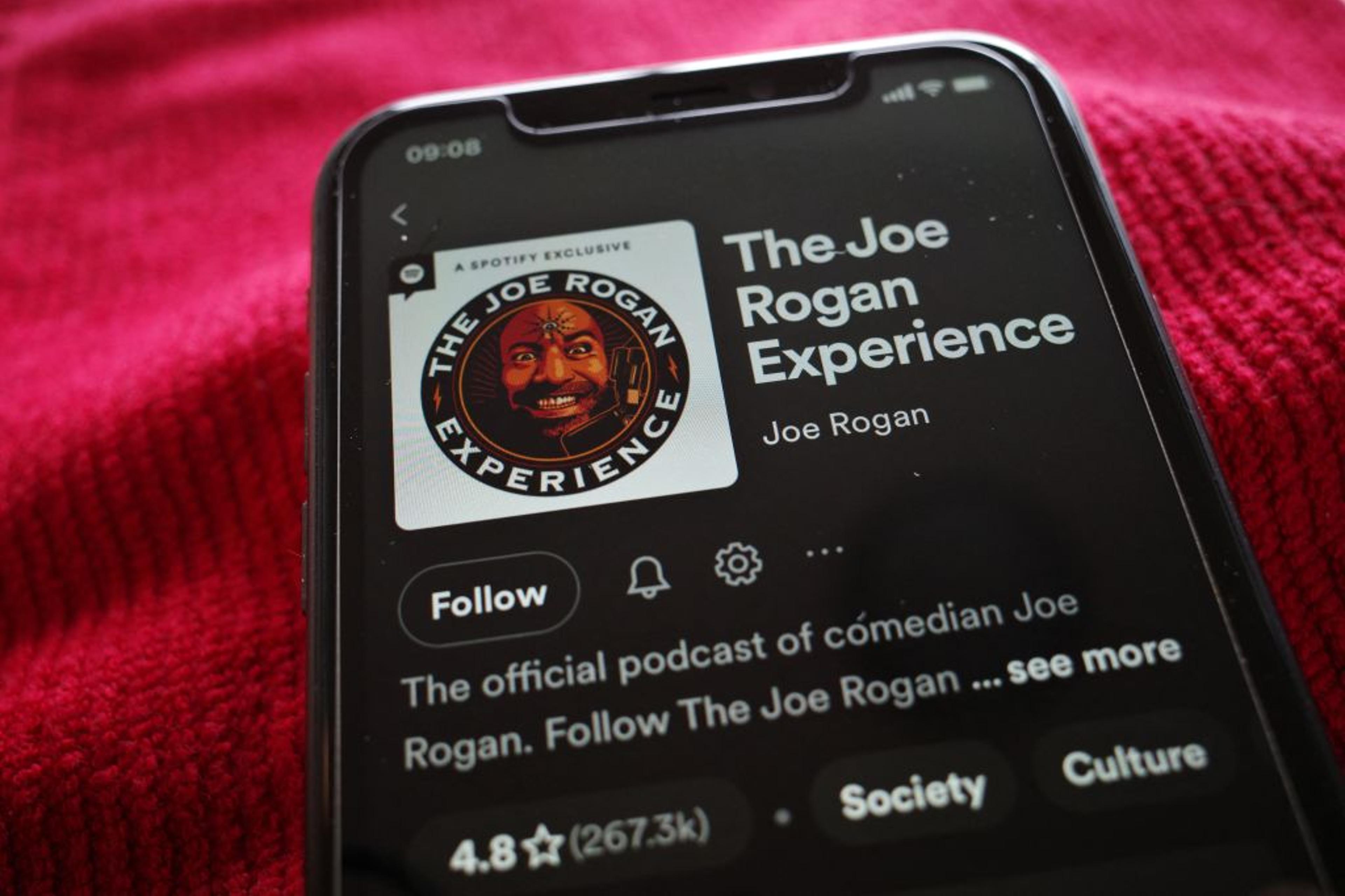 An illustration photo showing the Spotify page for "The Joe Rogan Experience" podcast displayed on a smart phone in Washington, DC on February 7, 2022.