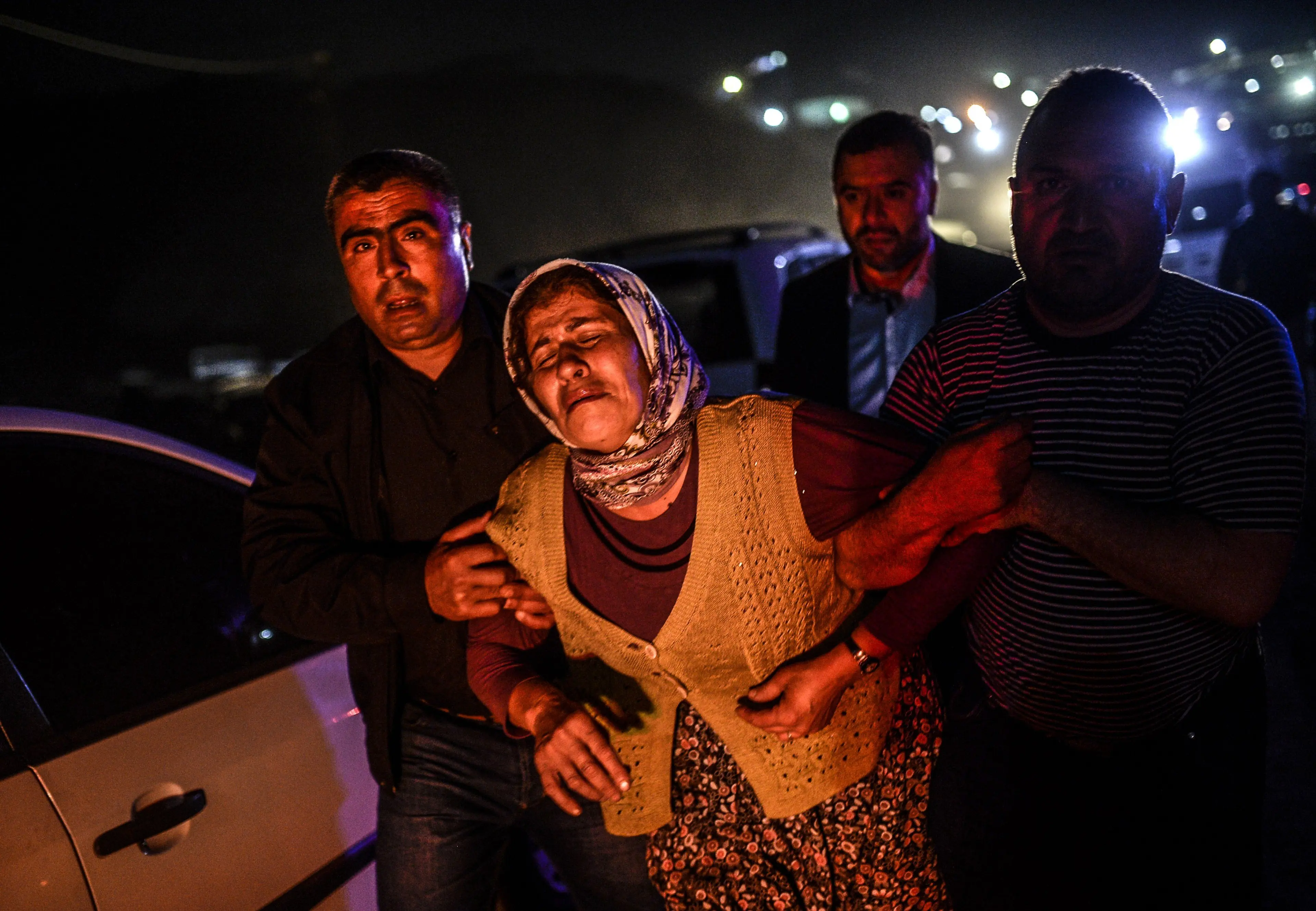 People cry after their relatives died in an explosion in Manisa on May 13, 2014.