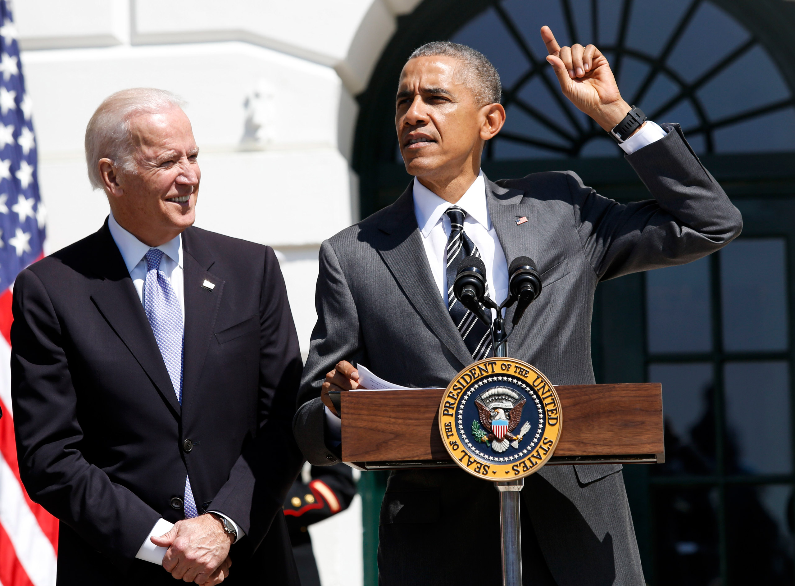 US President Barack Obama (R) speaks during the Wounded Warrior Ride event while Vice President Joe Biden (L) listens at the White House, in Washington, DC, USA on April 14, 2016. The event helps raise awareness to the public about severely injured veter