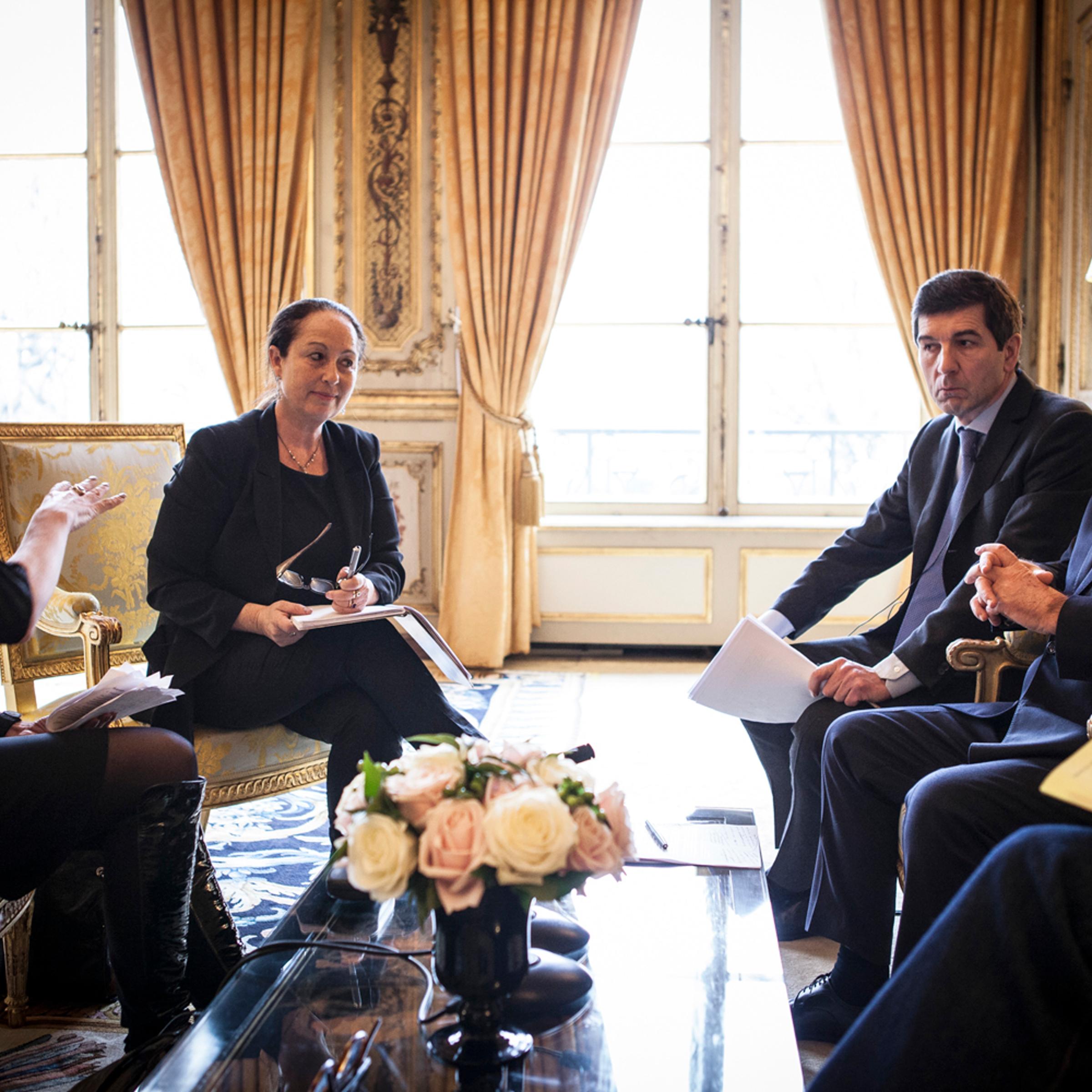 TIME's Catherine Mayer, left, and Vivienne Walt talk to François Hollande in the Élysée Palace, Paris.