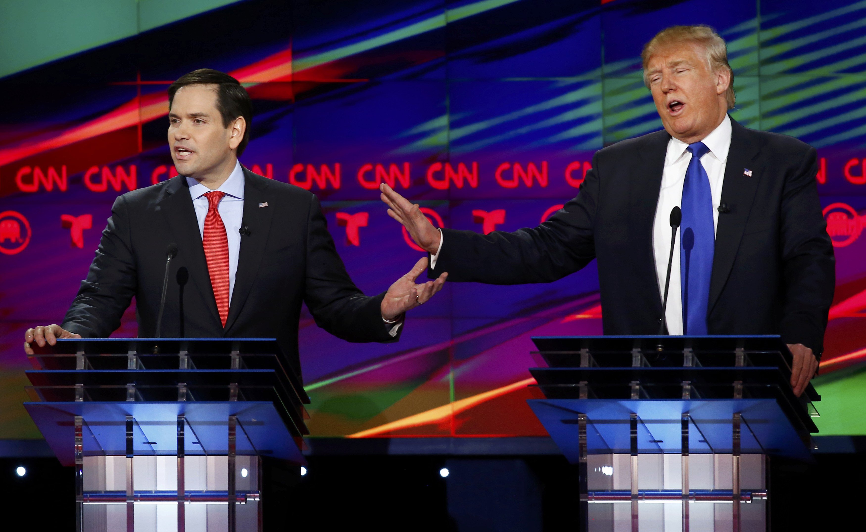 Republican U.S. presidential candidates Rubio and Trump discuss an issue during the debate sponsored by CNN for the 2016 Republican U.S. presidential candidates in Houston