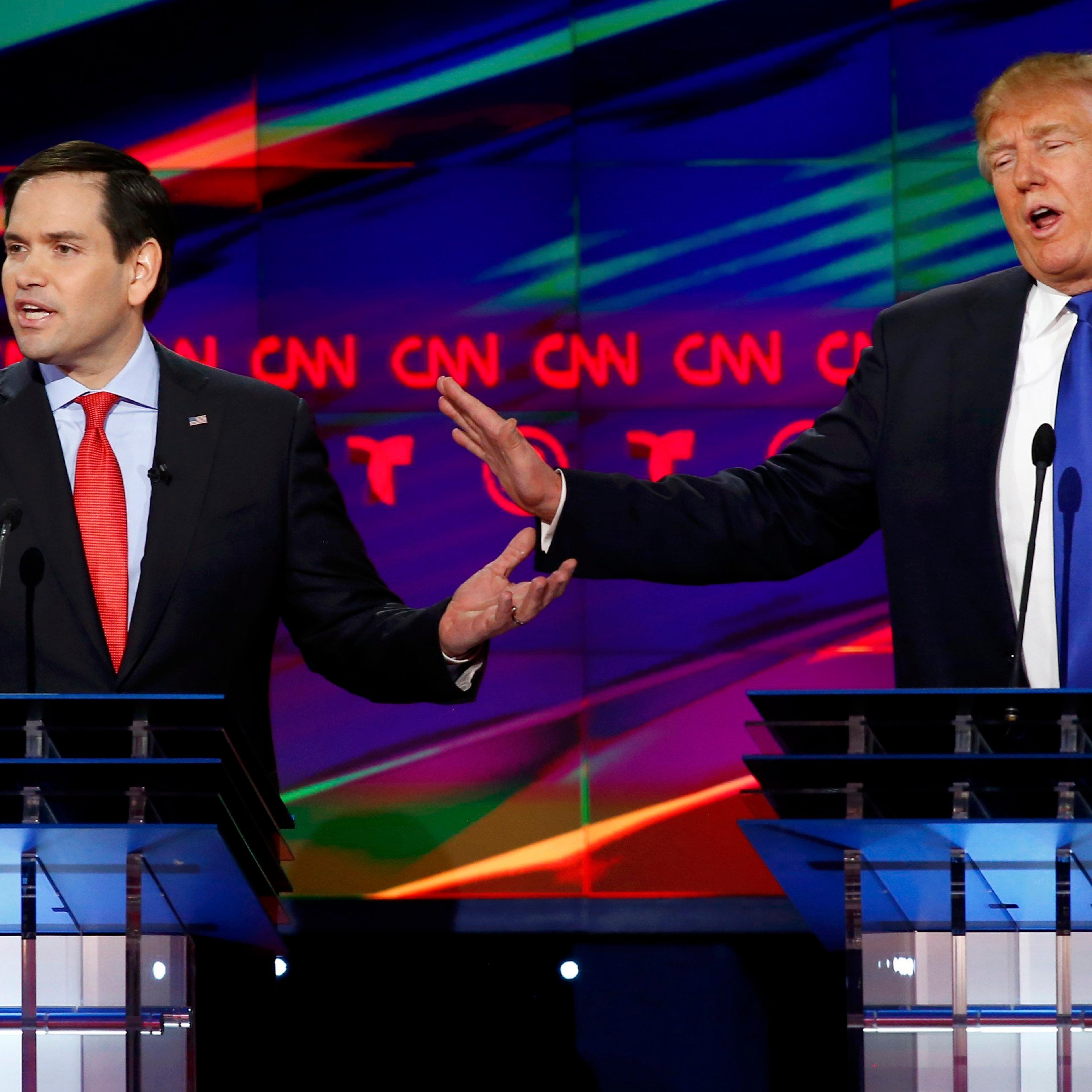 Republican U.S. presidential candidates Rubio and Trump discuss an issue during the debate sponsored by CNN for the 2016 Republican U.S. presidential candidates in Houston