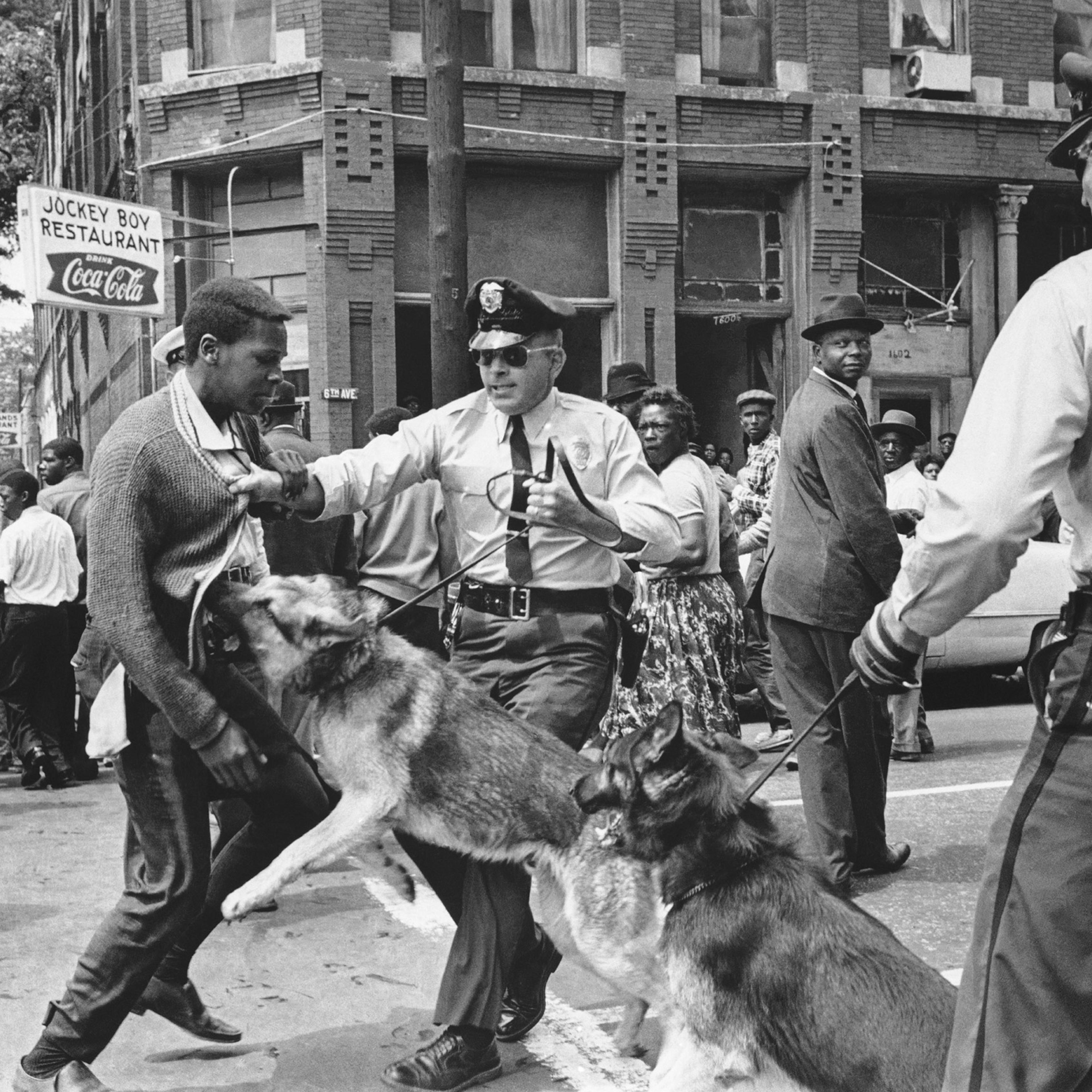 Iconic image by Bill Hudson of a Birmingham protestor in Birmingham, 1963.