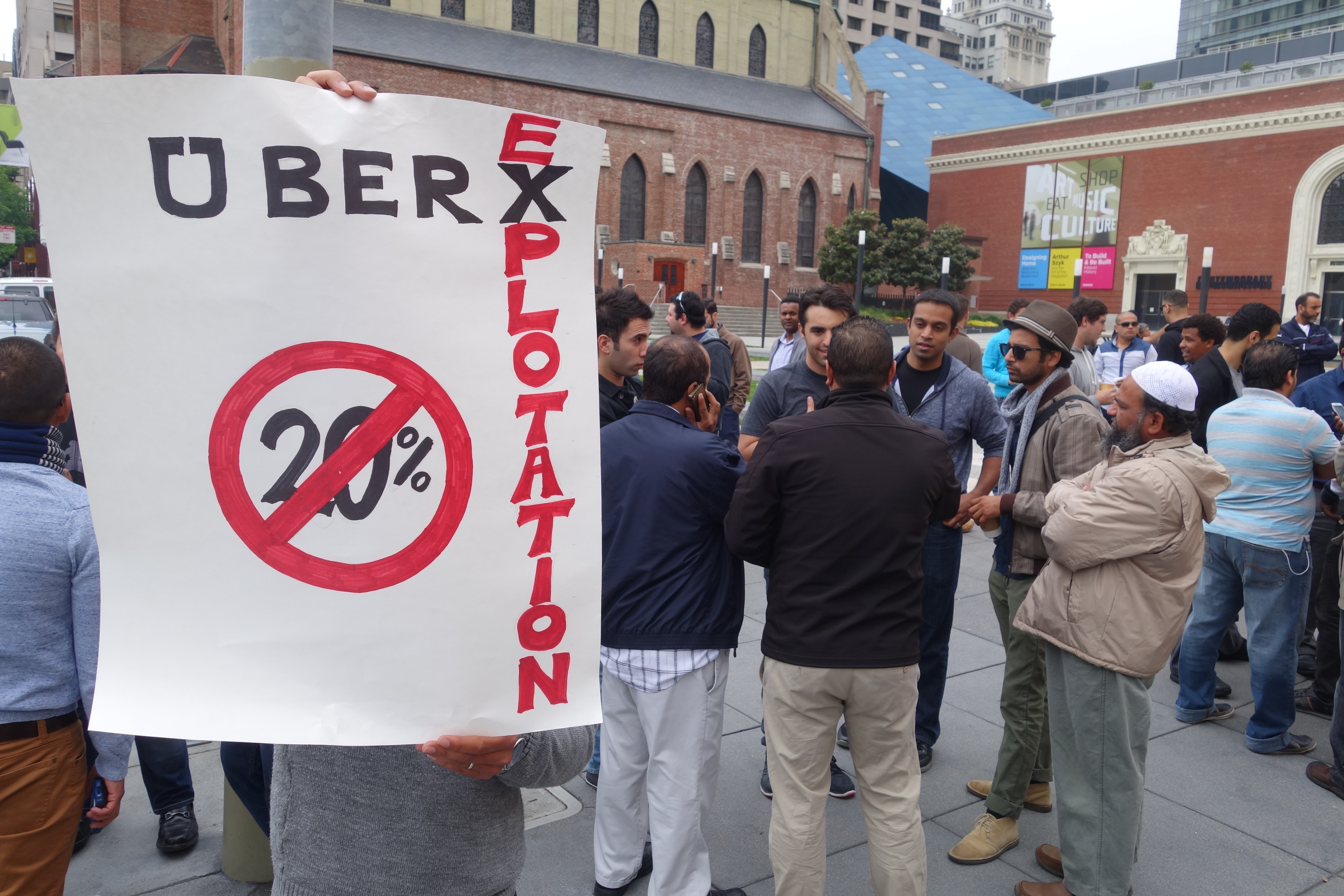 UberX drivers protest outside Uber headquarters in San Francisco on May 8, 2014. 